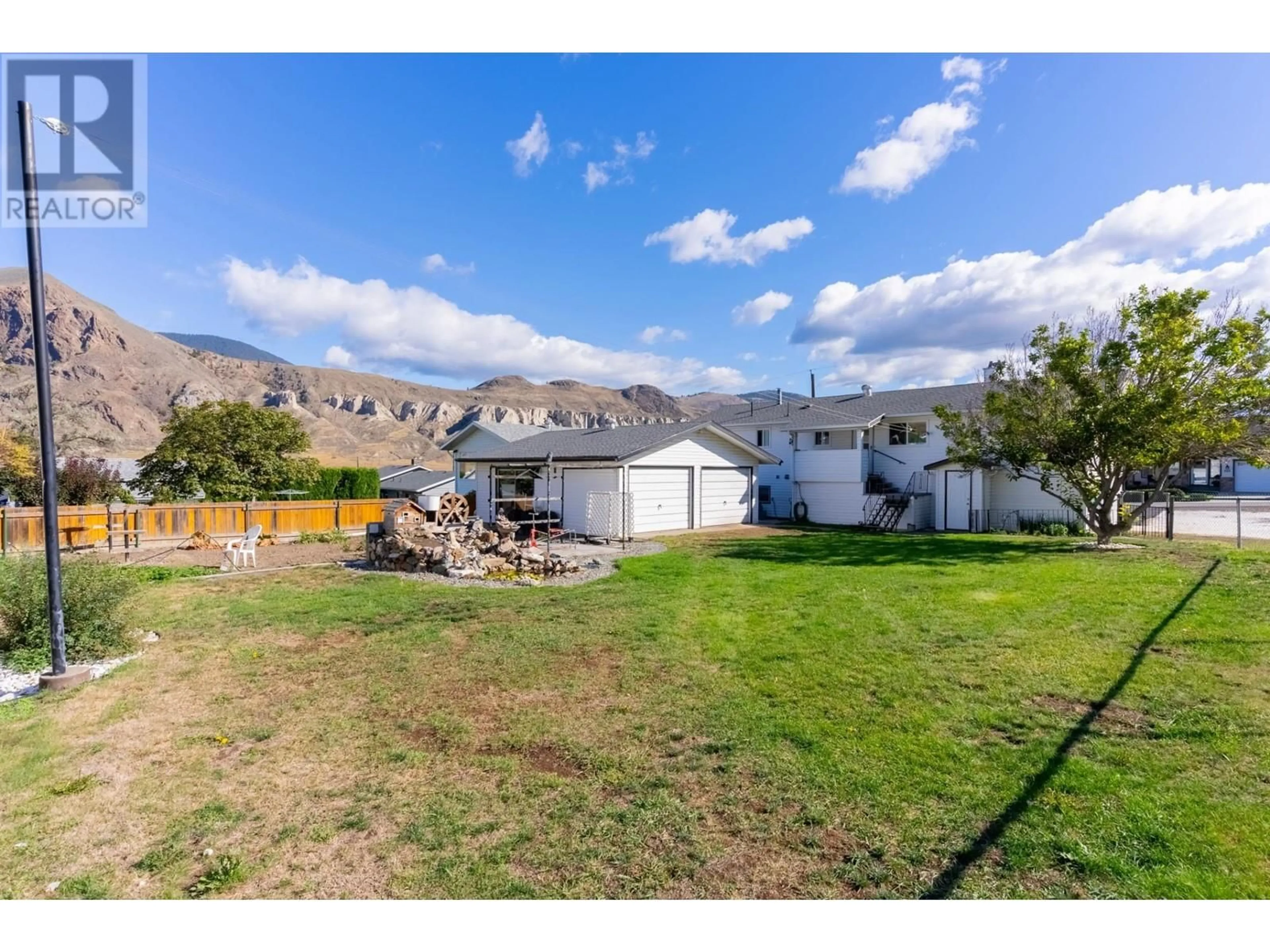 Frontside or backside of a home, the fenced backyard for 215 O'CONNOR Road, Kamloops British Columbia V2C5A4