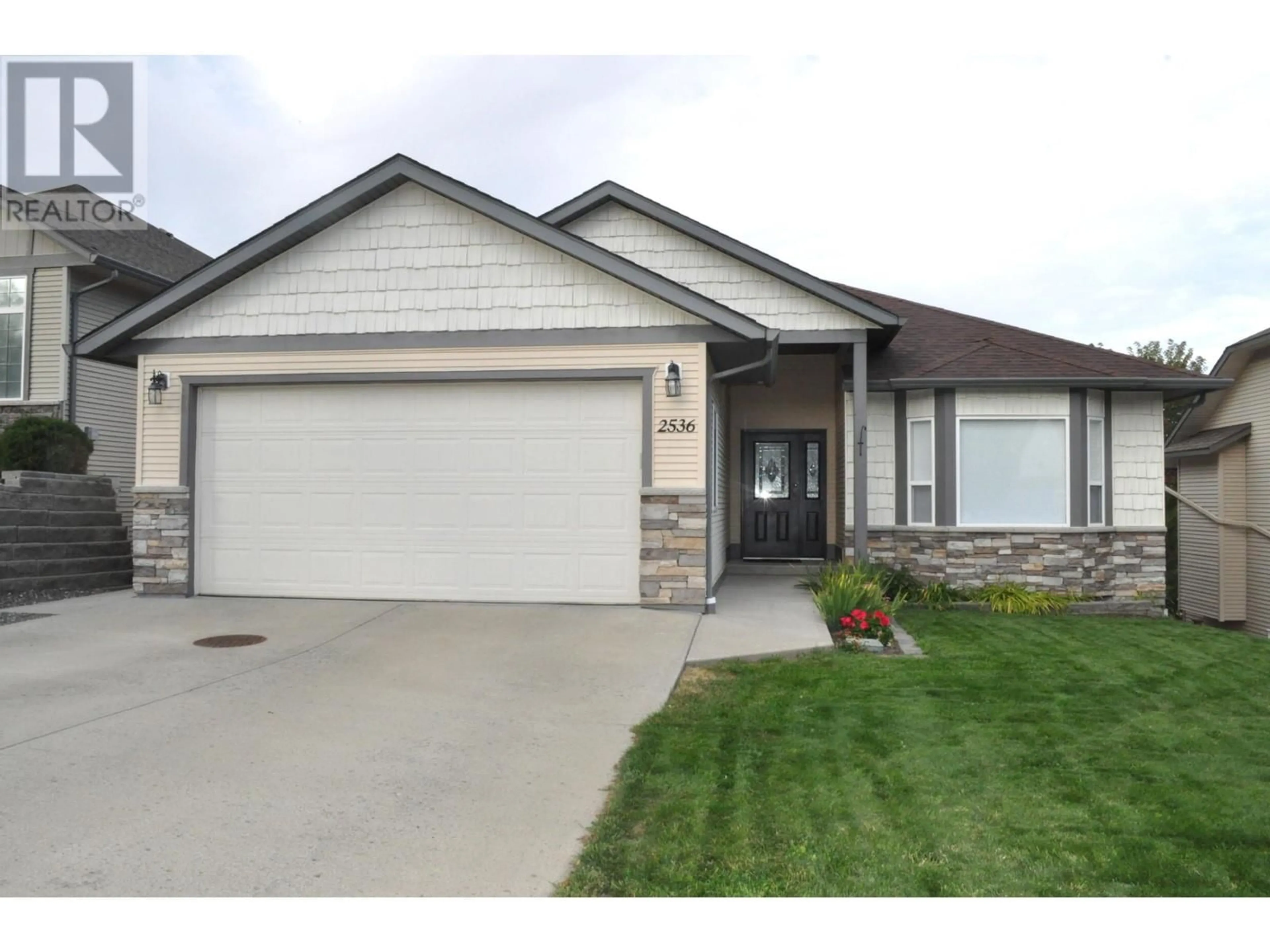 Frontside or backside of a home, the street view for 2536 ABBEYGLEN Way, Kamloops British Columbia V1S1Z6