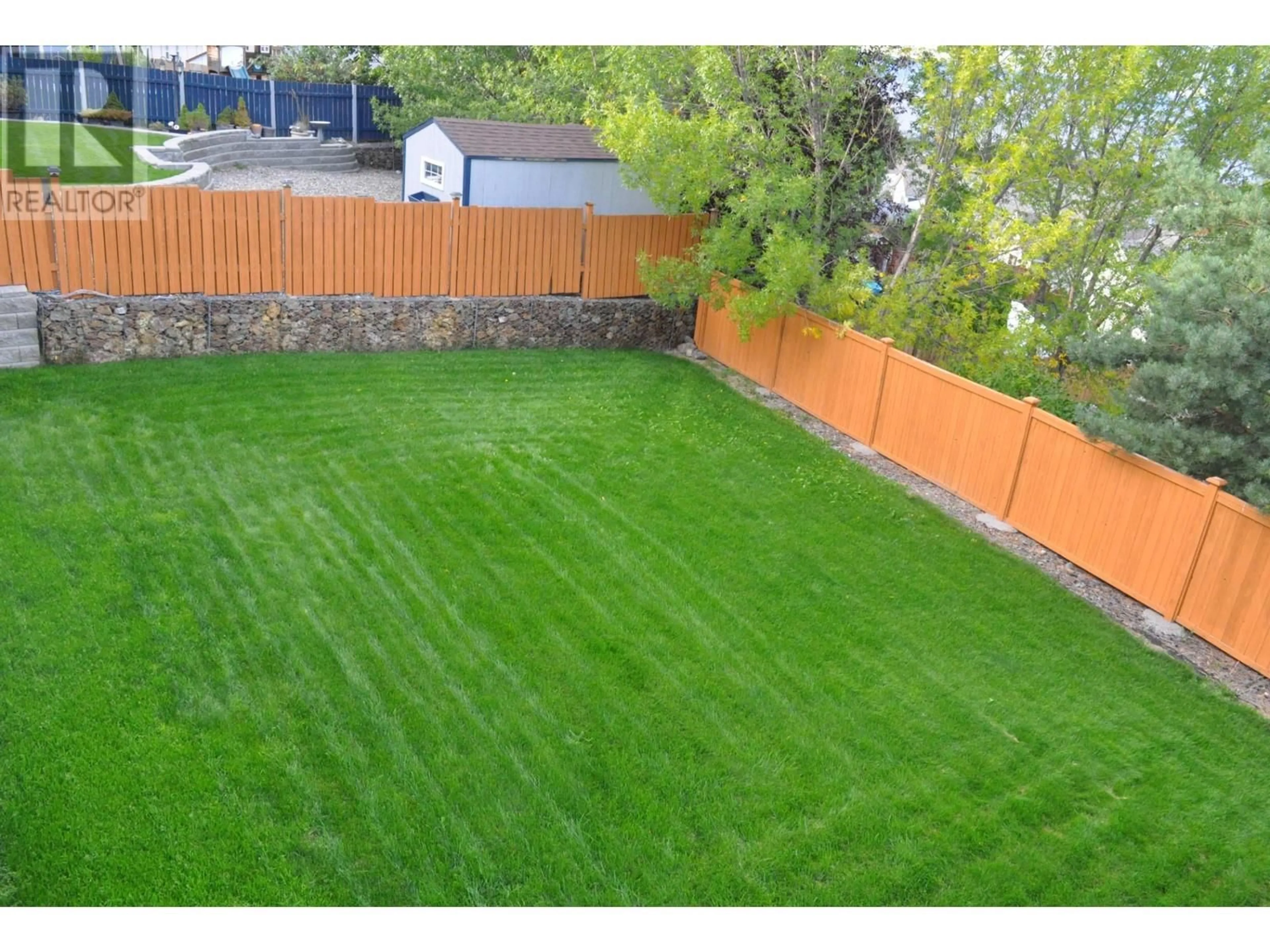 Patio, the fenced backyard for 2536 ABBEYGLEN Way, Kamloops British Columbia V1S1Z6