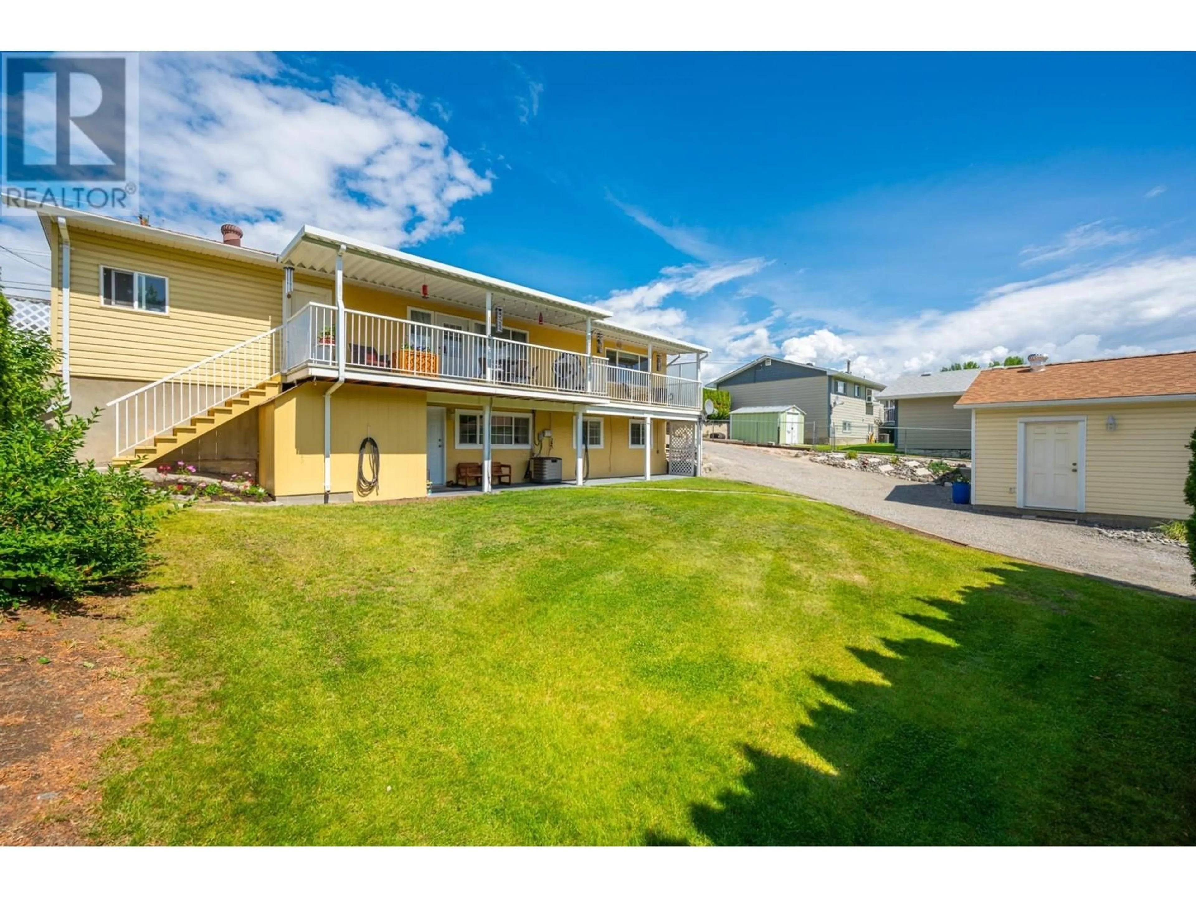 A pic from exterior of the house or condo, the fenced backyard for 707 ELM Street, Ashcroft British Columbia V0K1A0