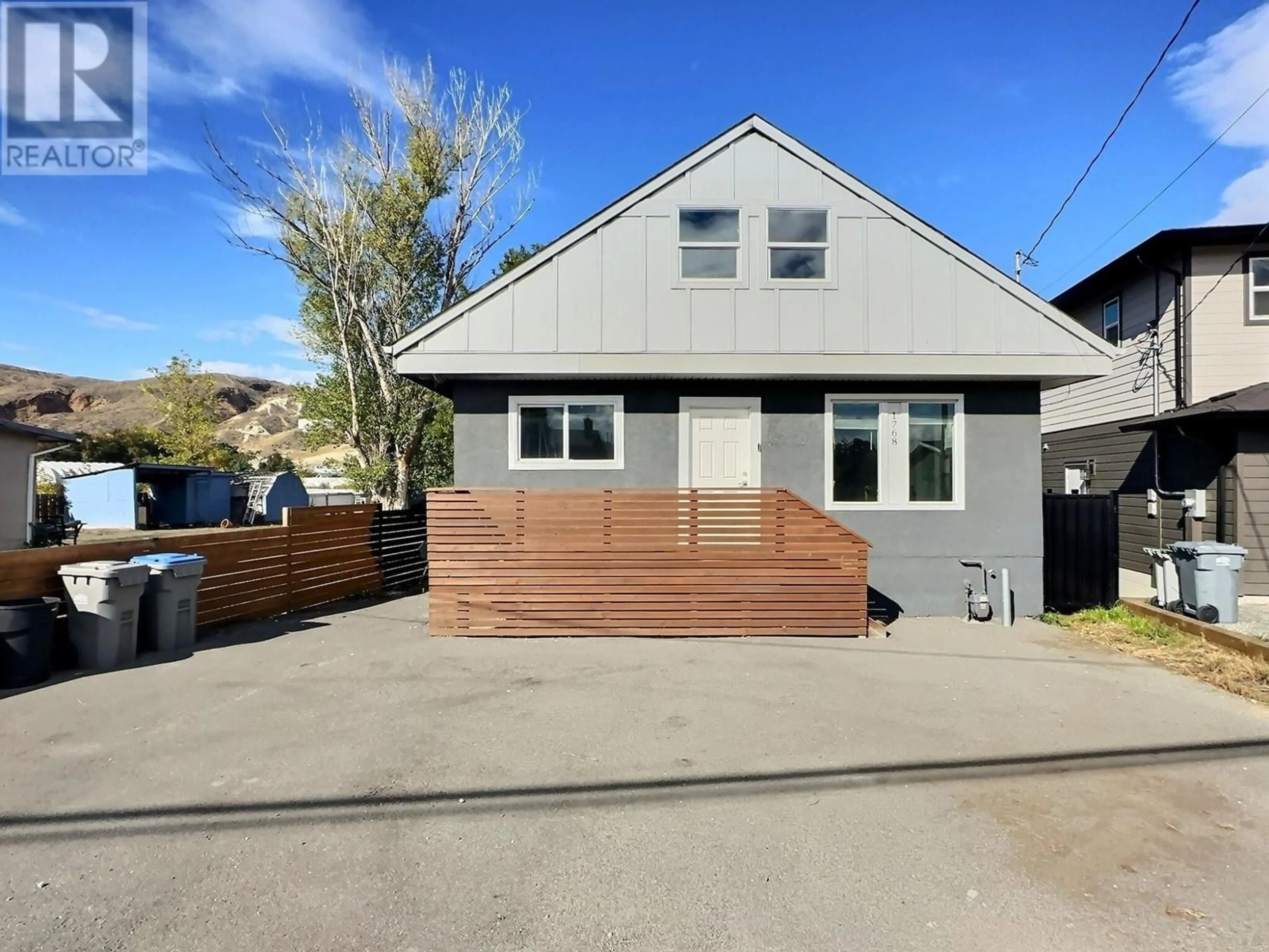 Frontside or backside of a home, the fenced backyard for 1768 PARKCREST Avenue, Kamloops British Columbia V2B4W9