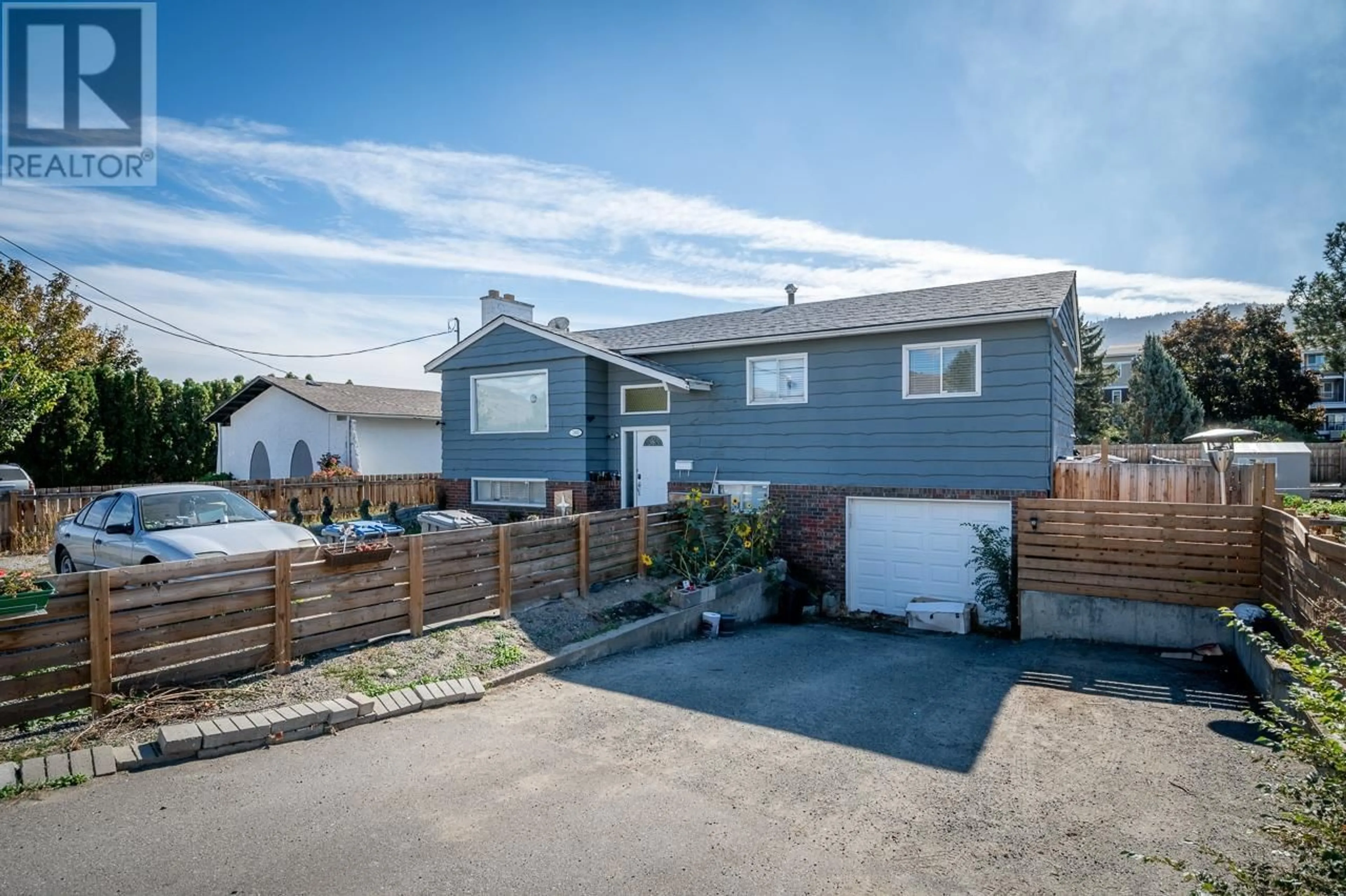 Frontside or backside of a home, the fenced backyard for 1885 TRANQUILLE Road, Kamloops British Columbia V2B3M3