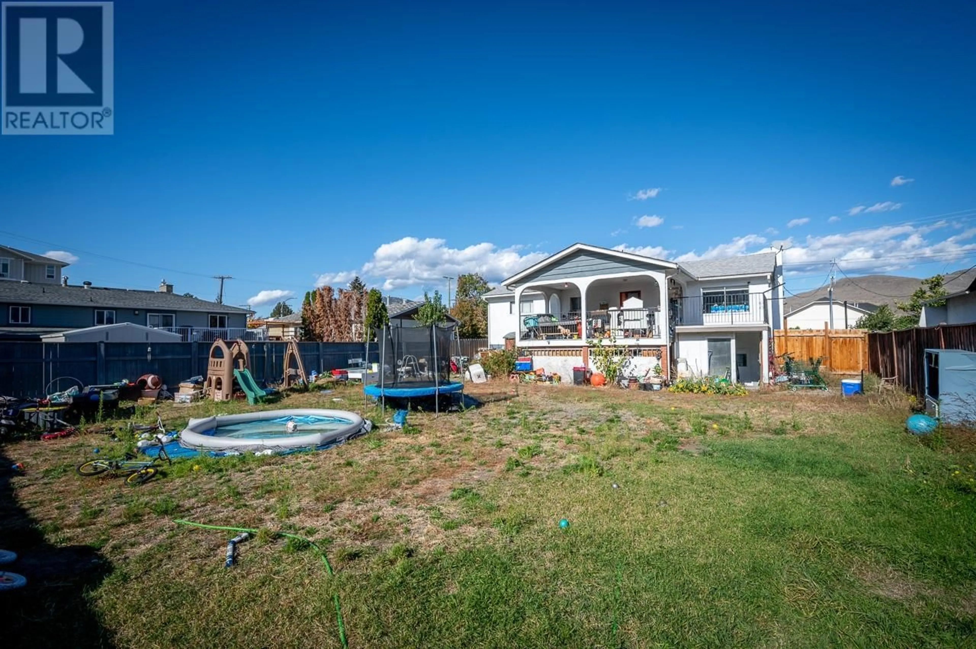 Frontside or backside of a home, the fenced backyard for 1885 TRANQUILLE Road, Kamloops British Columbia V2B3M3