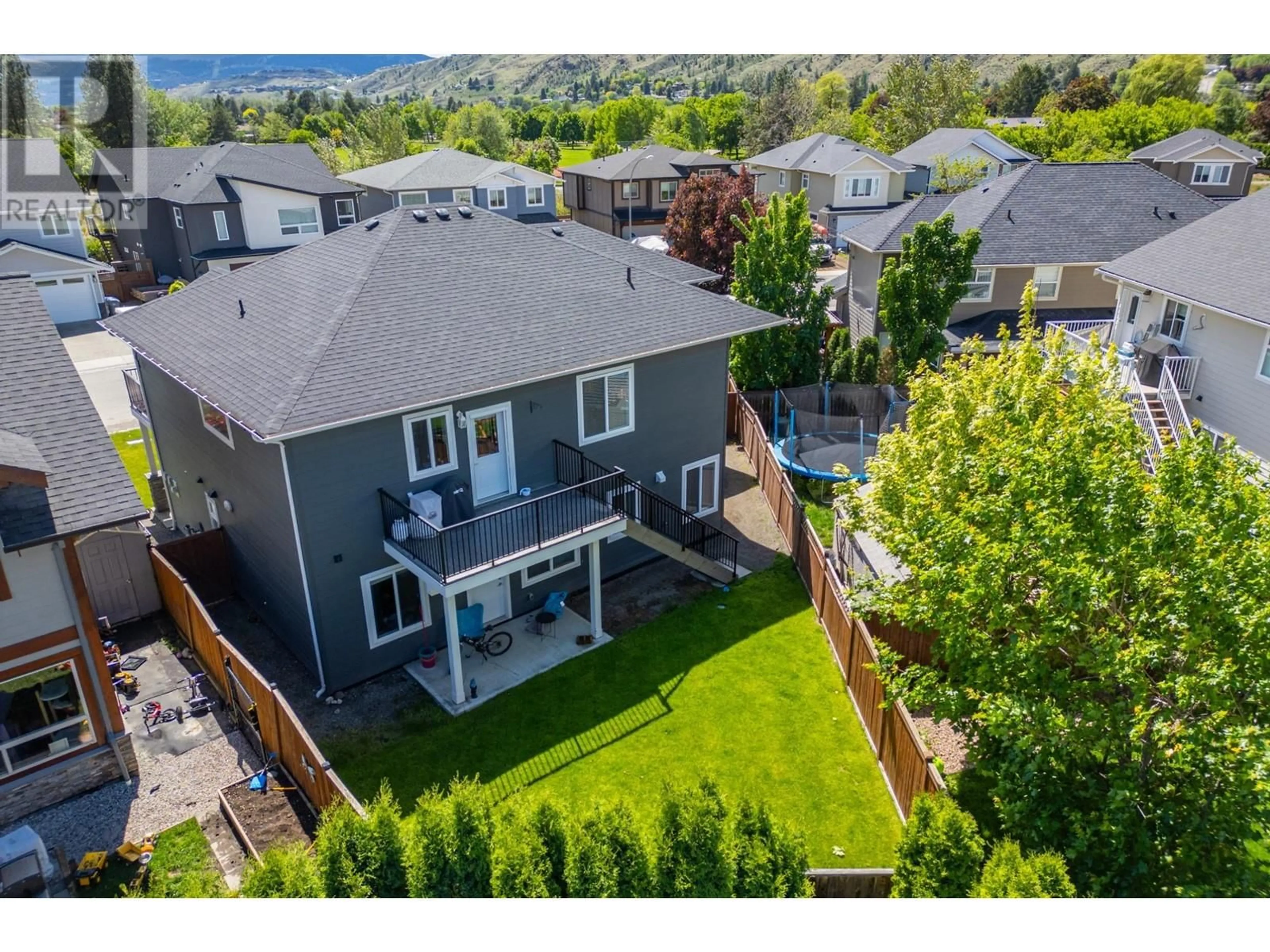 Frontside or backside of a home, the fenced backyard for 2765 BEACHMOUNT Crescent, Kamloops British Columbia V2B0E6