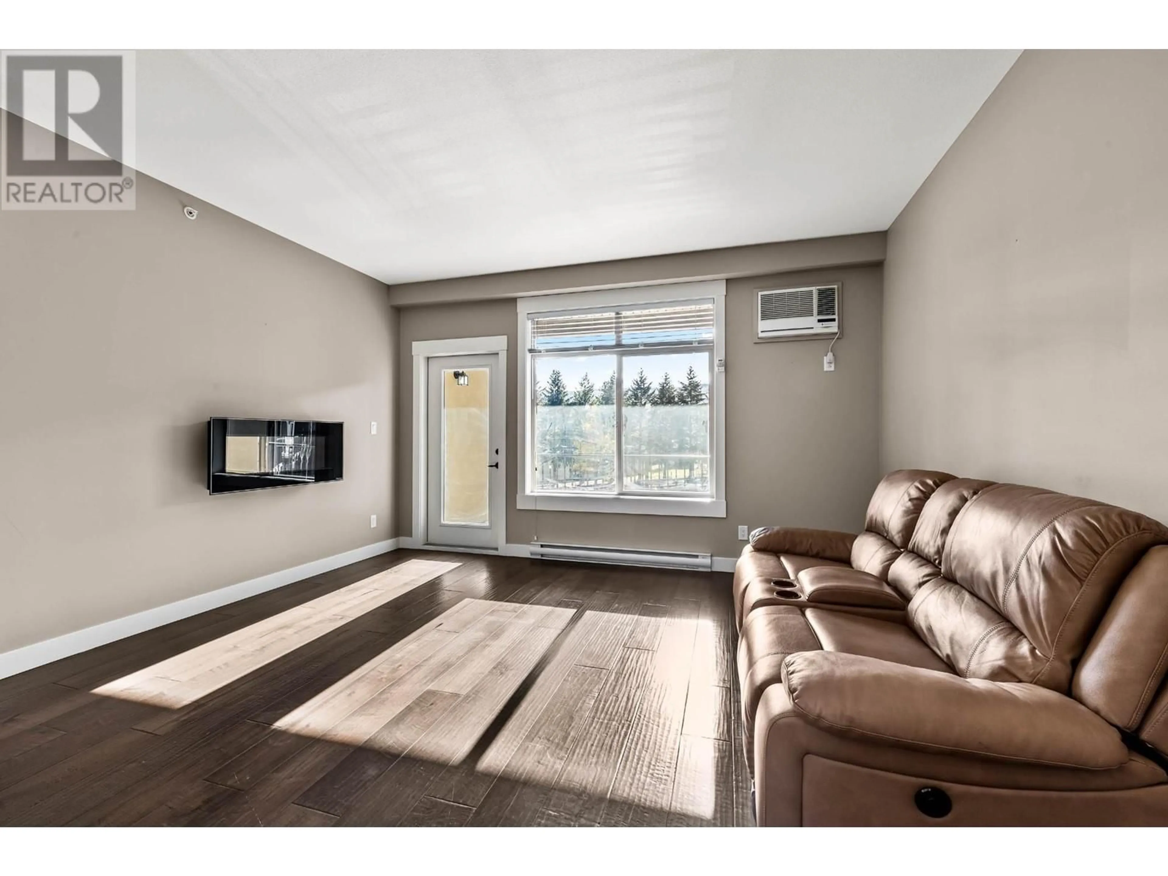 Living room, wood floors for 755 MCGILL Road Unit# 404, Kamloops British Columbia V2H1T7