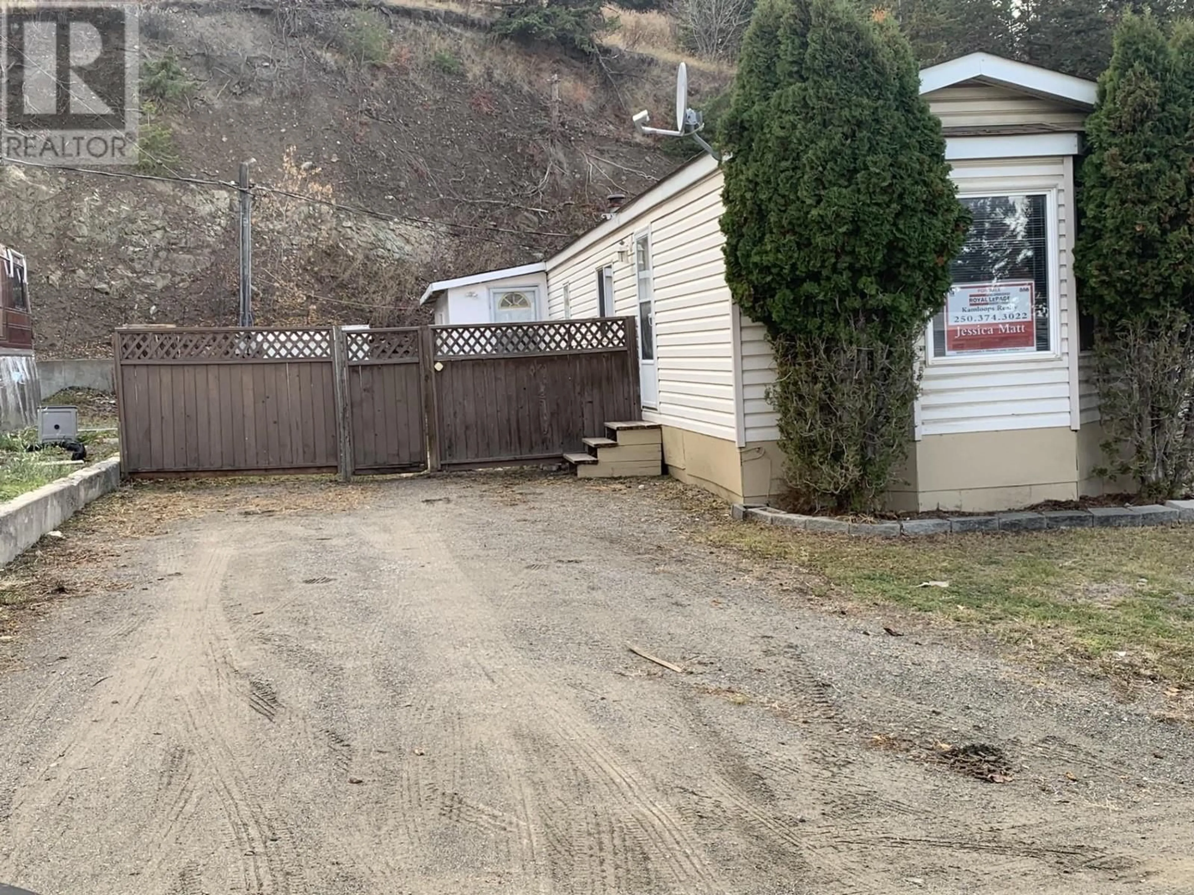 Frontside or backside of a home, the fenced backyard for 1680 LAC LE JEUNE Road Unit# 9, Kamloops British Columbia V2H1T7