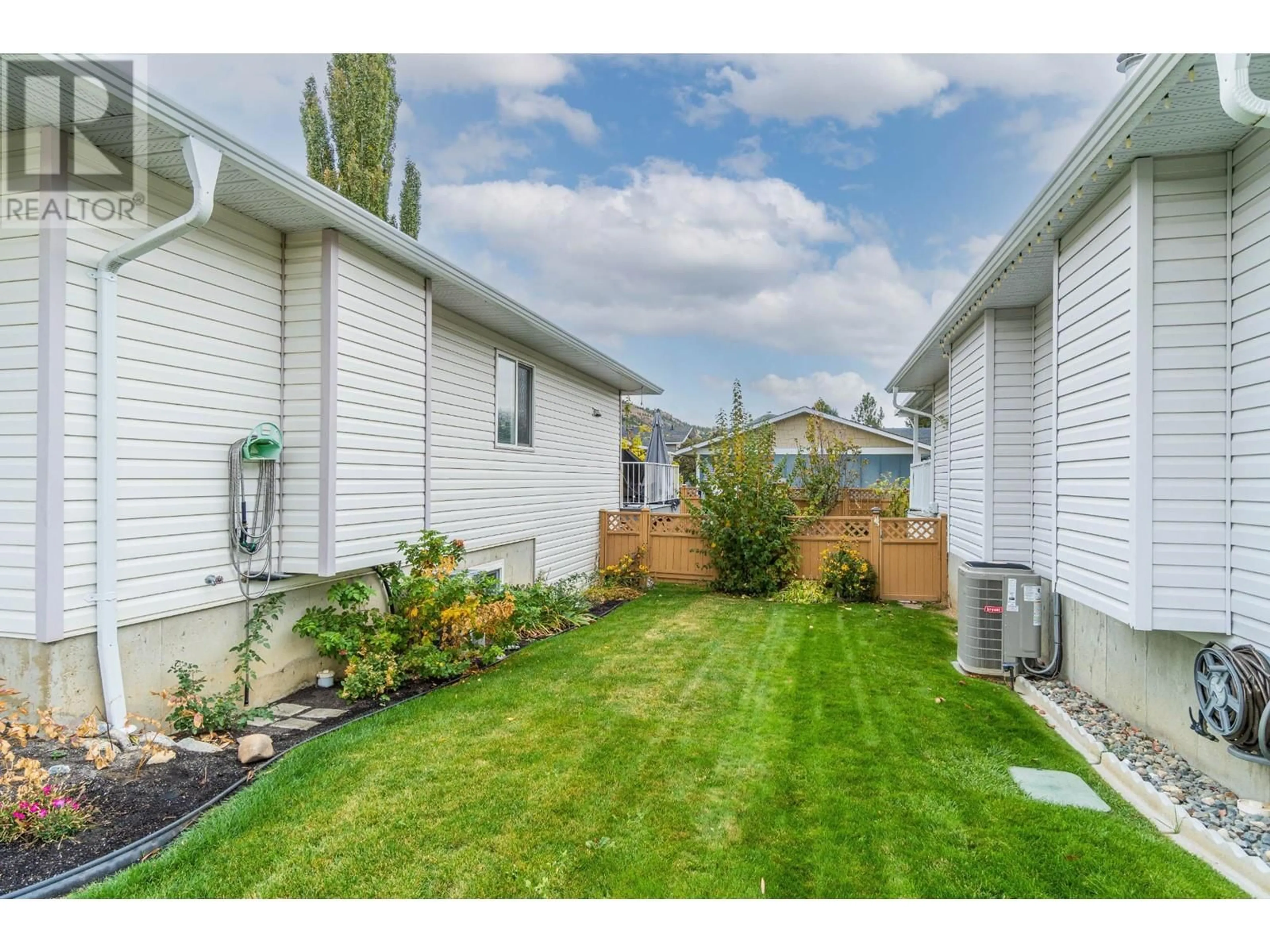 Frontside or backside of a home, the fenced backyard for 2655 WESTSYDE Road Unit# 16, Kamloops British Columbia V2B7C7