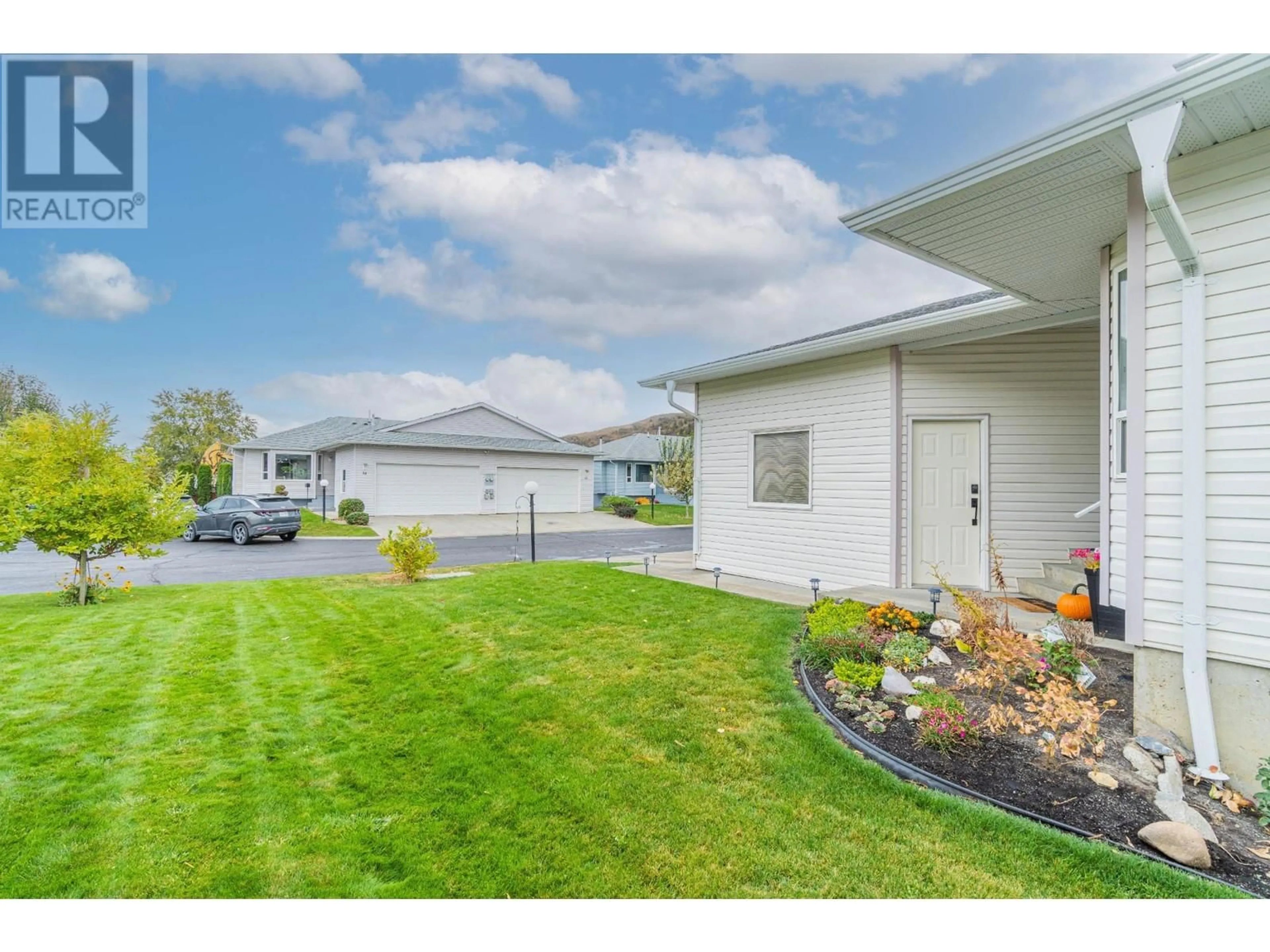 Frontside or backside of a home, the fenced backyard for 2655 WESTSYDE Road Unit# 16, Kamloops British Columbia V2B7C7