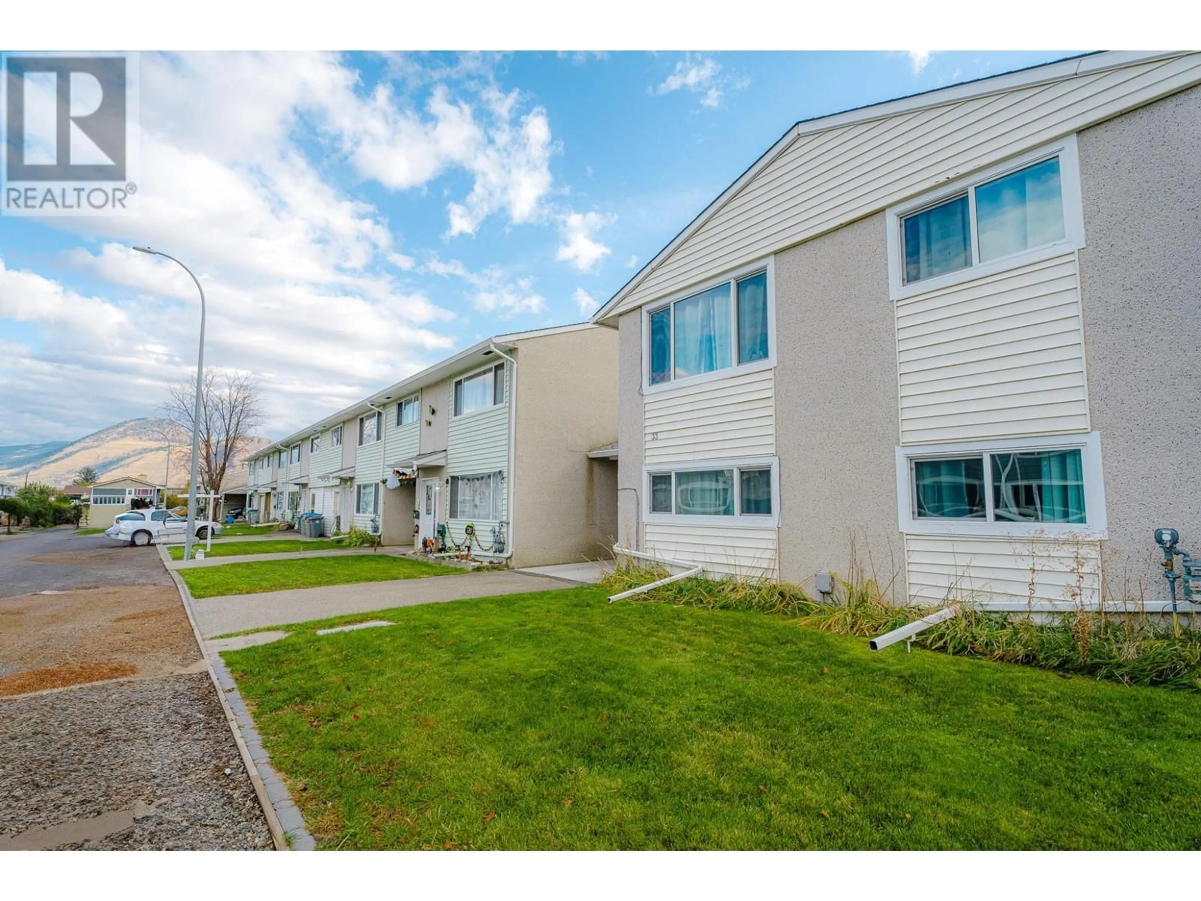 A pic from exterior of the house or condo, the fenced backyard for 800 VALHALLA Drive Unit# 33, Kamloops British Columbia V2H1T7