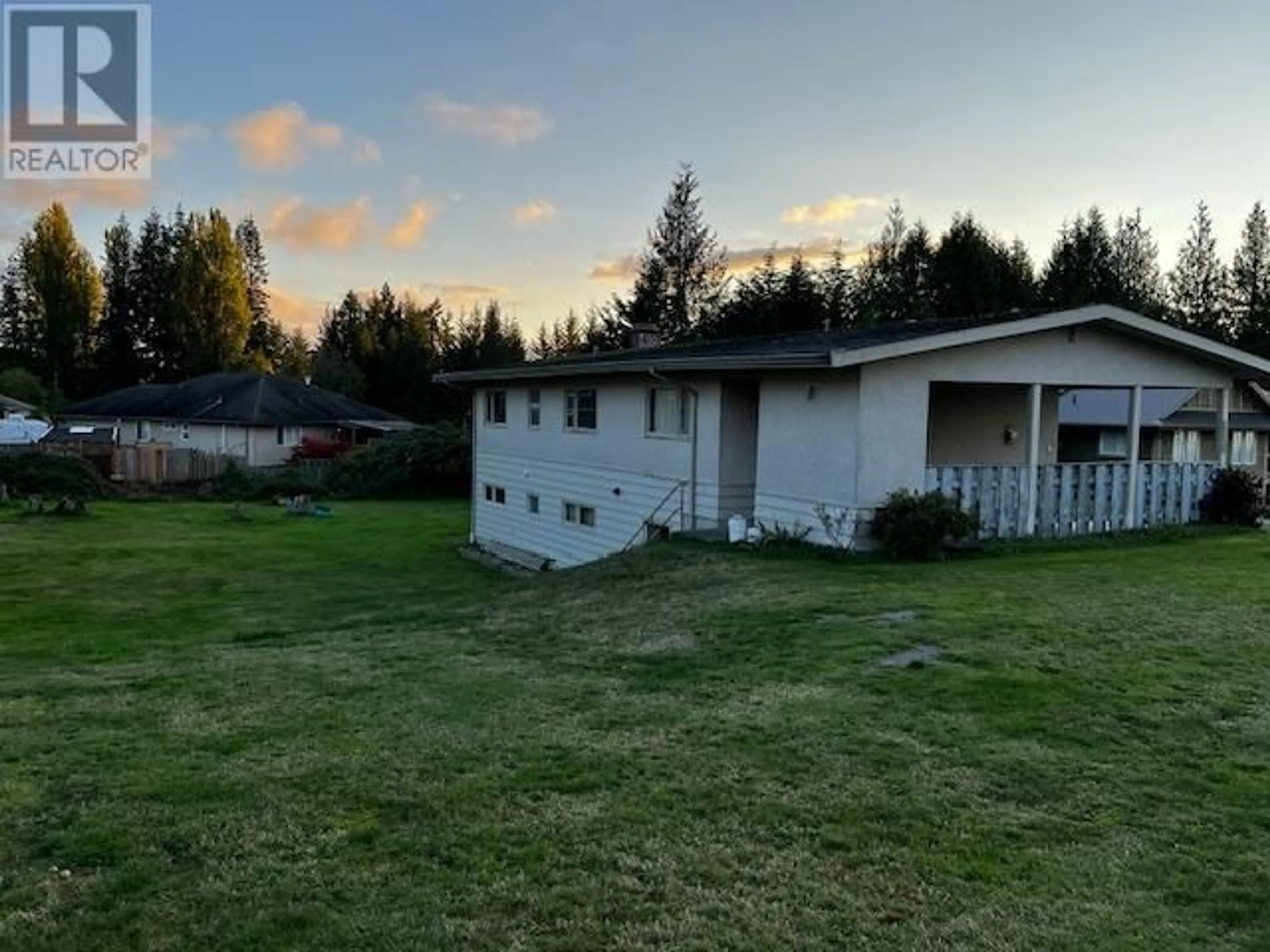 Frontside or backside of a home, the fenced backyard for 7050 PENTICTON STREET, Powell River British Columbia V8A1J9