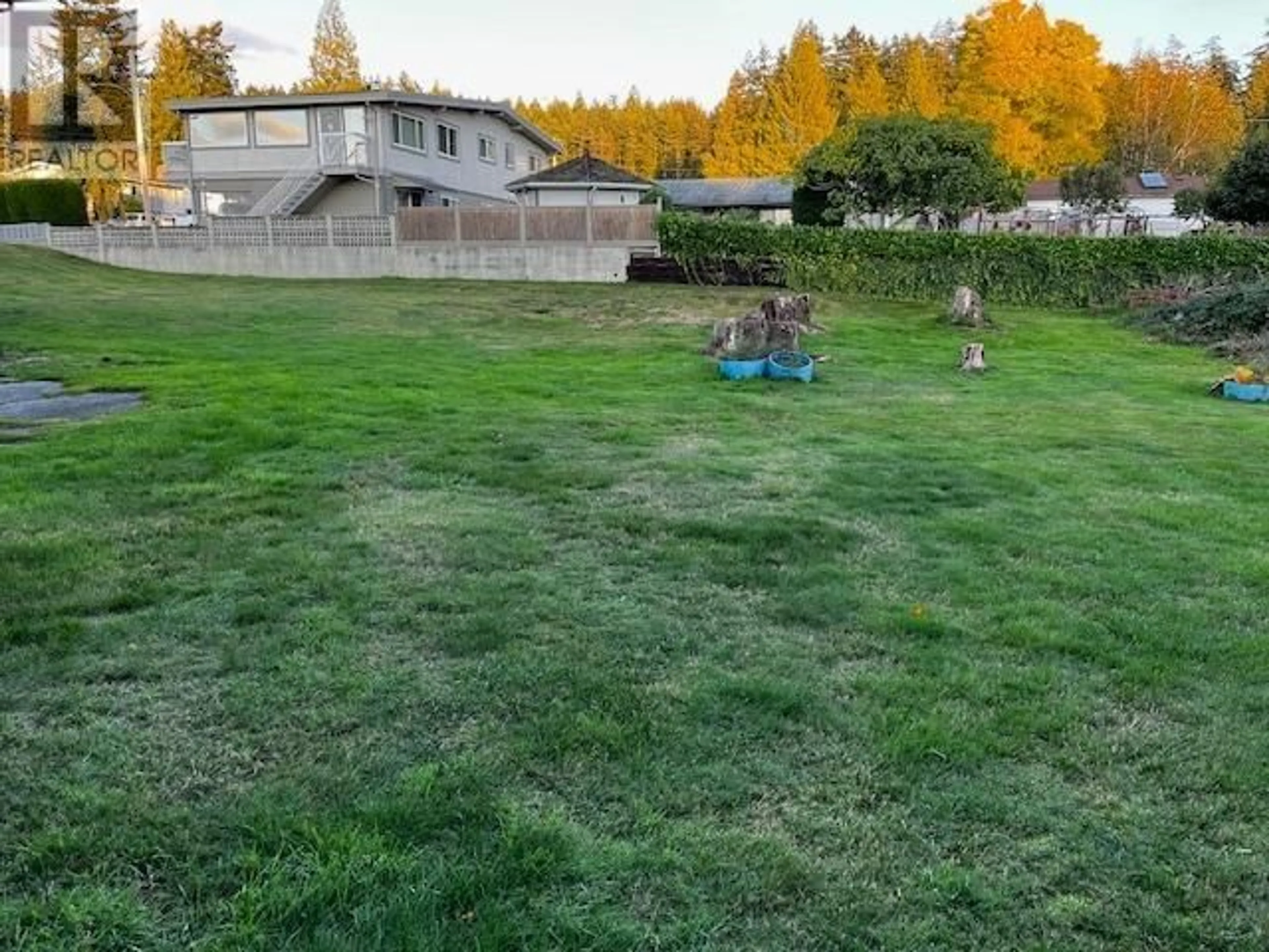 Frontside or backside of a home, the fenced backyard for 7050 PENTICTON STREET, Powell River British Columbia V8A1J9