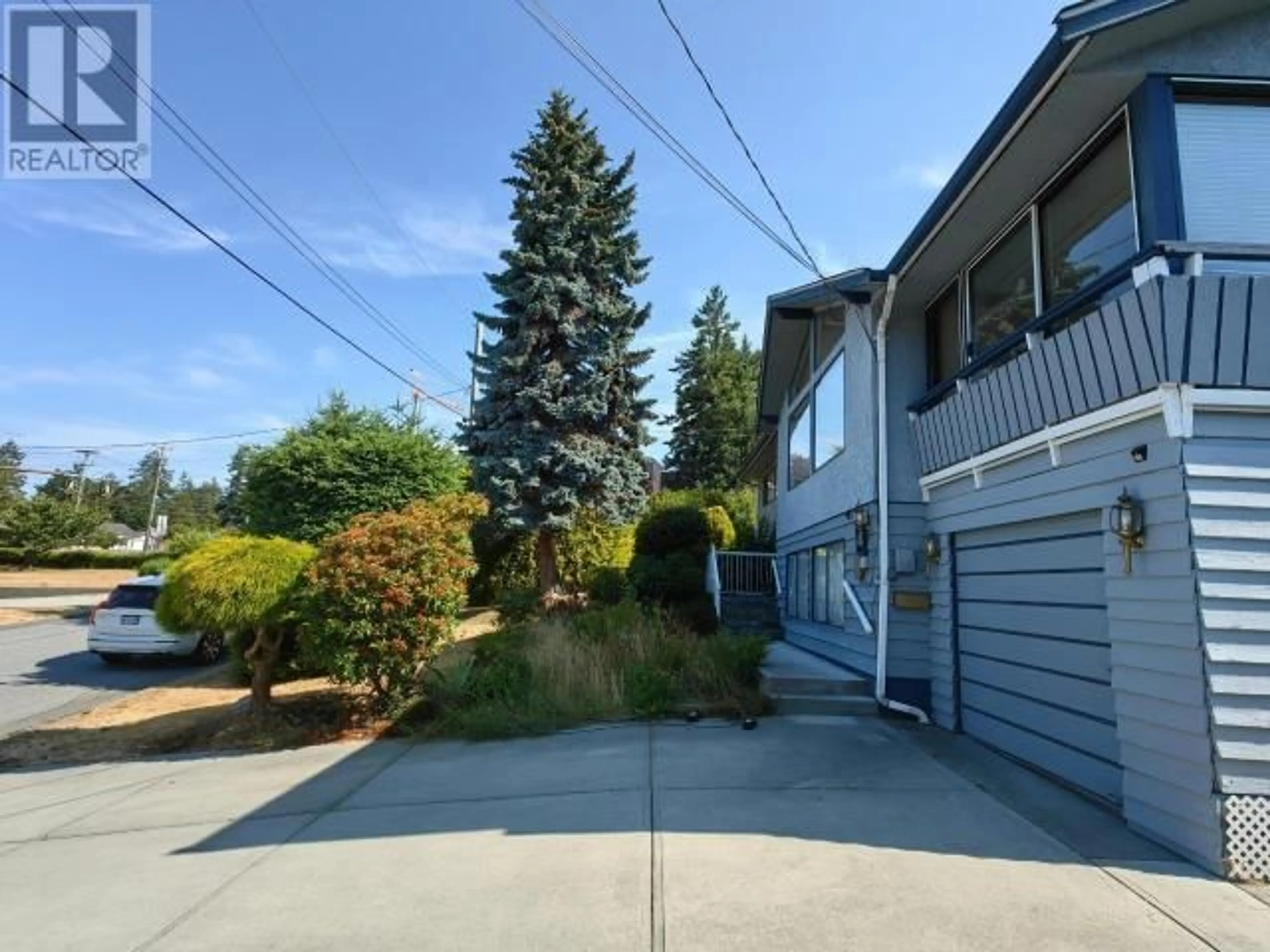 Frontside or backside of a home, the fenced backyard for 3298 VANANDA AVE, Powell River British Columbia V8A1B1