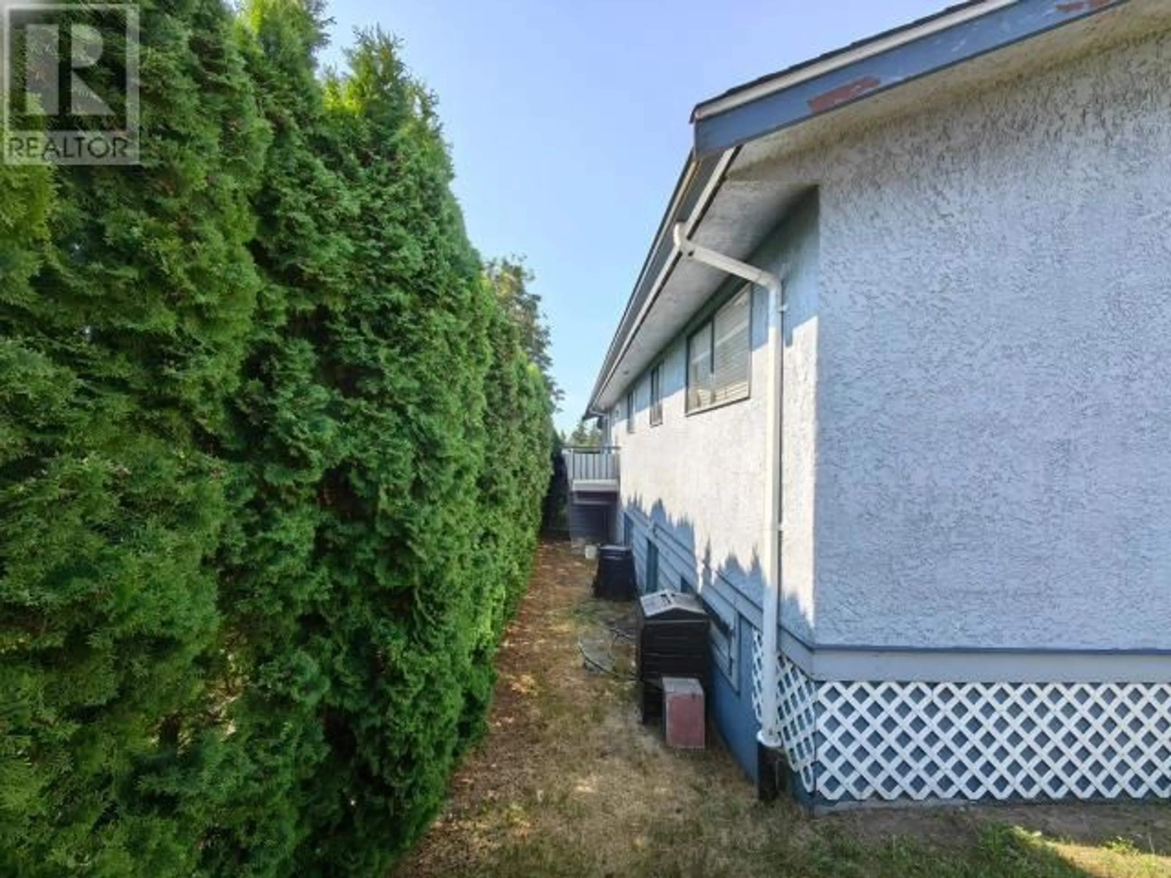 Frontside or backside of a home, the fenced backyard for 3298 VANANDA AVE, Powell River British Columbia V8A1B1