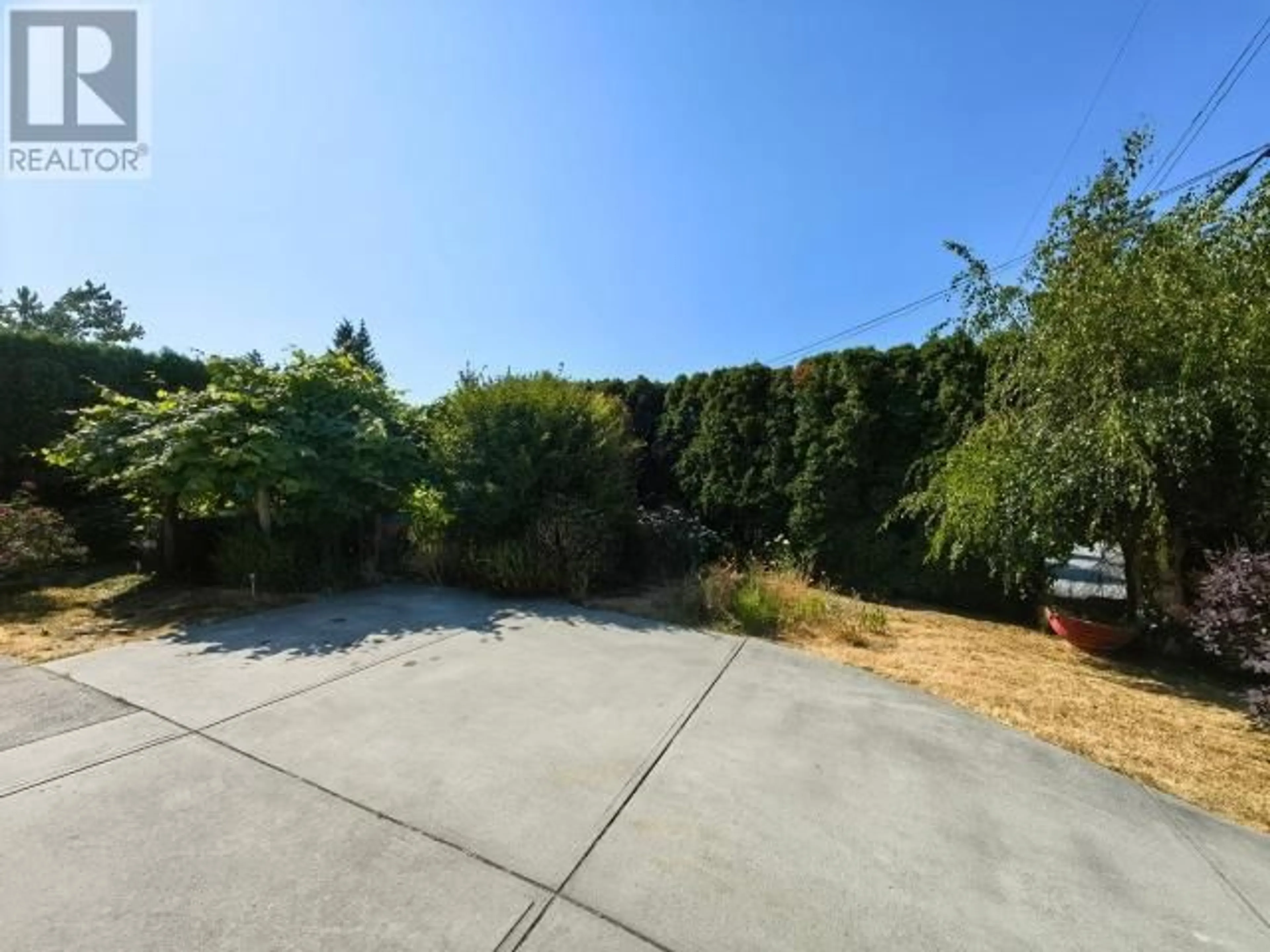 Frontside or backside of a home, the fenced backyard for 3298 VANANDA AVE, Powell River British Columbia V8A1B1