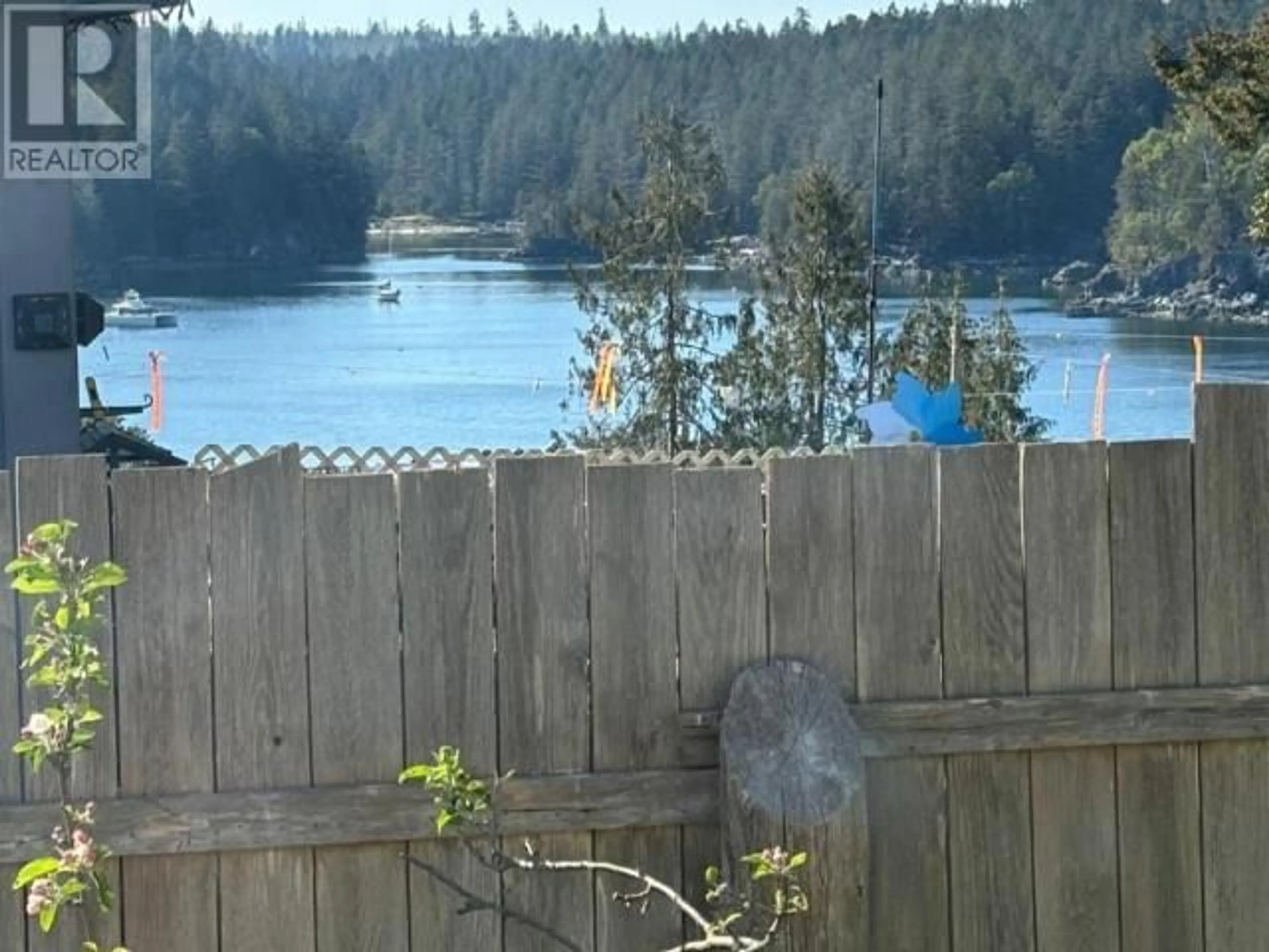 Patio, the fenced backyard for 1990 WATERMAN AVE, Texada Island British Columbia V0N1W0