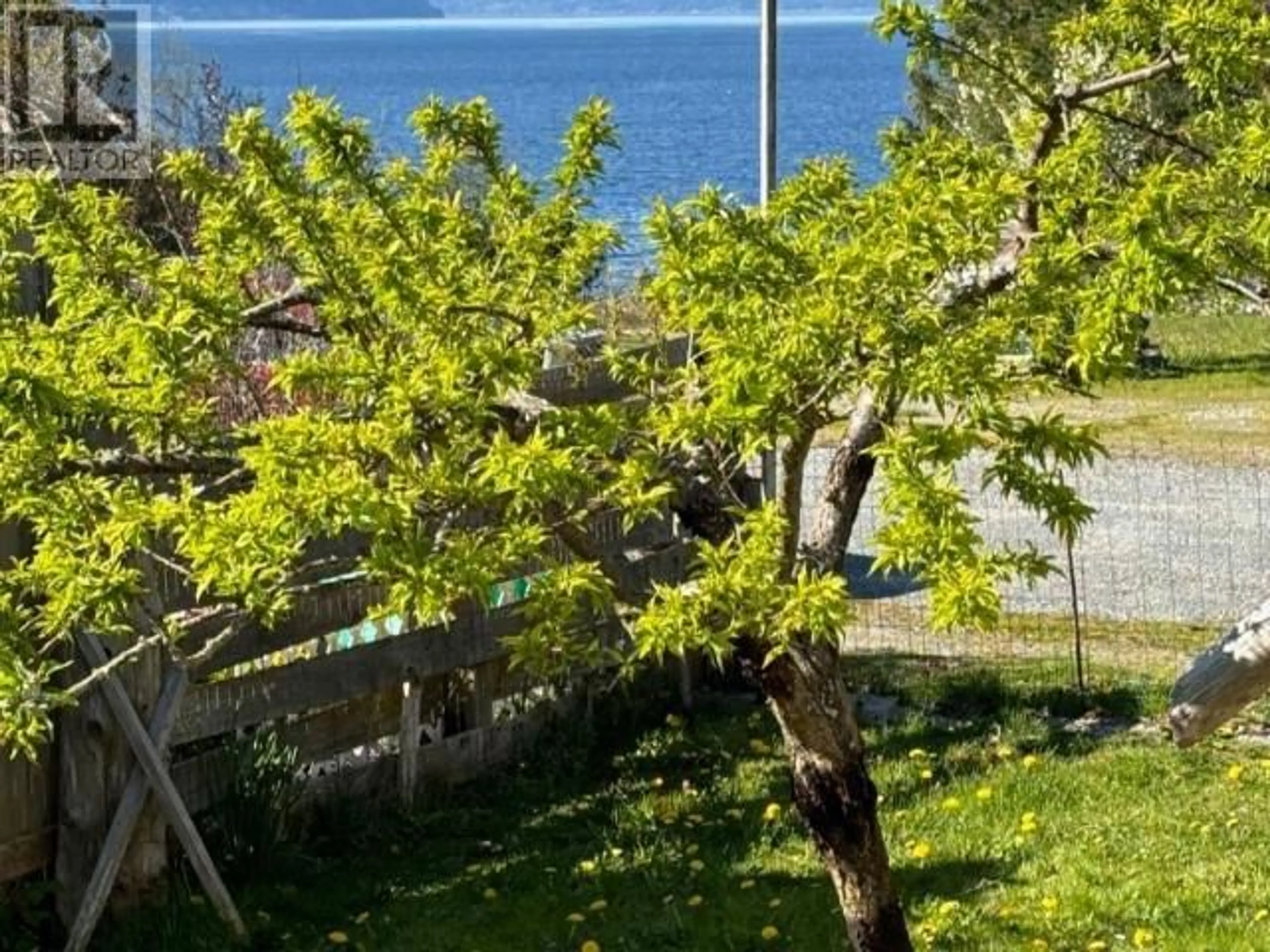 A pic from exterior of the house or condo, the fenced backyard for 1990 WATERMAN AVE, Texada Island British Columbia V0N1W0