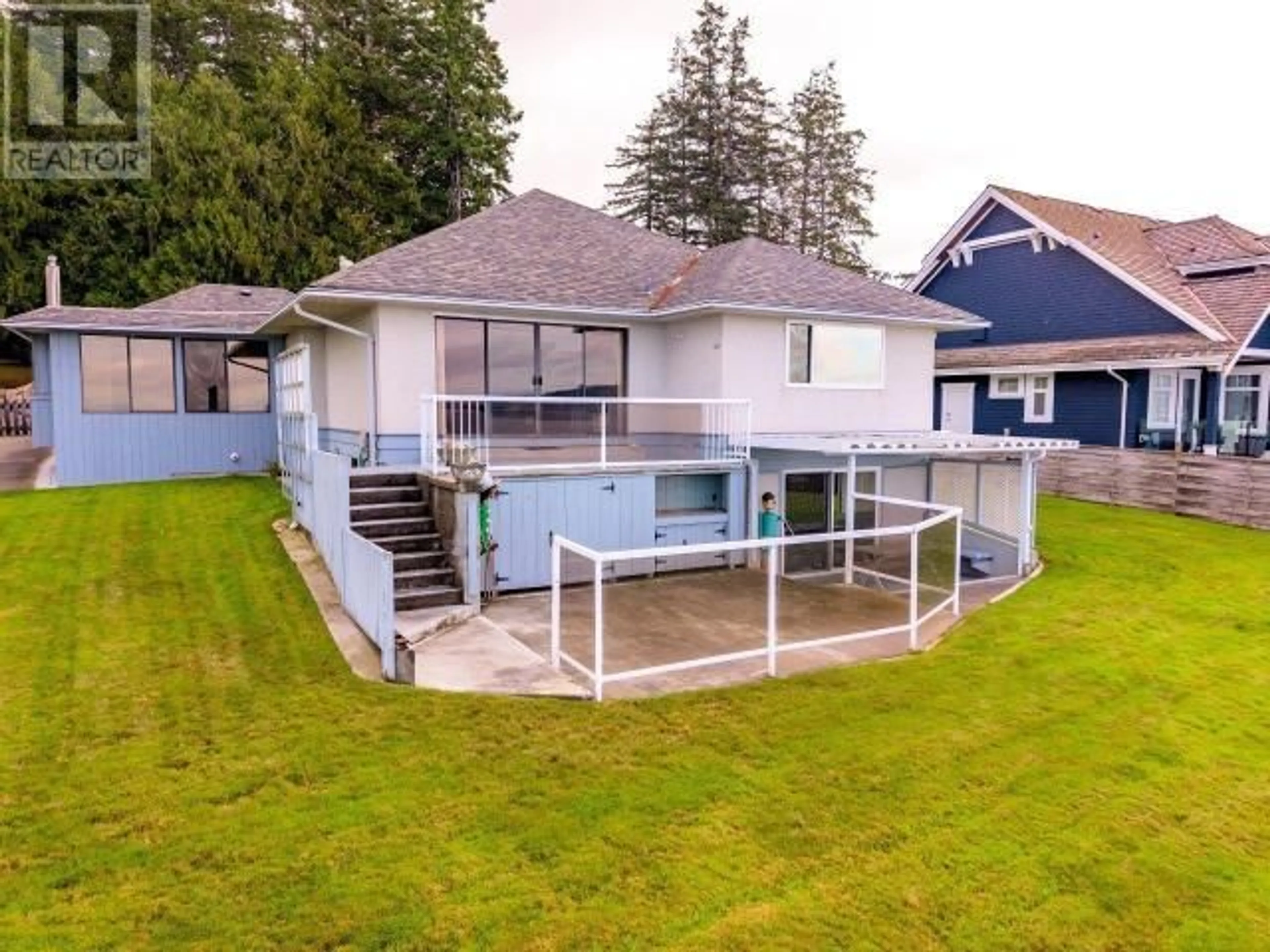 Frontside or backside of a home, the fenced backyard for 3495 MARINE AVE, Powell River British Columbia V8A2H3