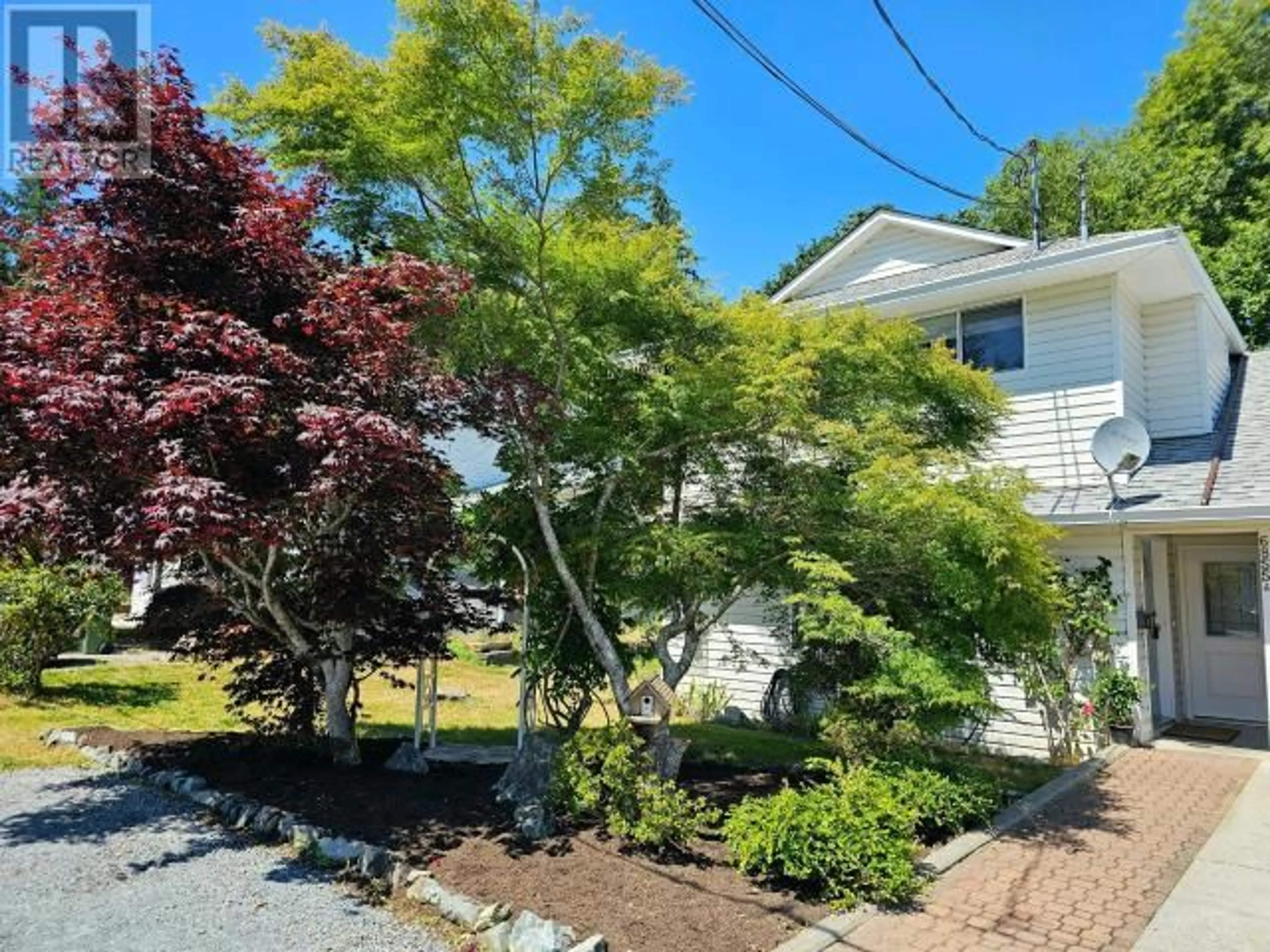 Frontside or backside of a home, the fenced backyard for A-6855 IRVINE STREET, Powell River British Columbia V8A4A8