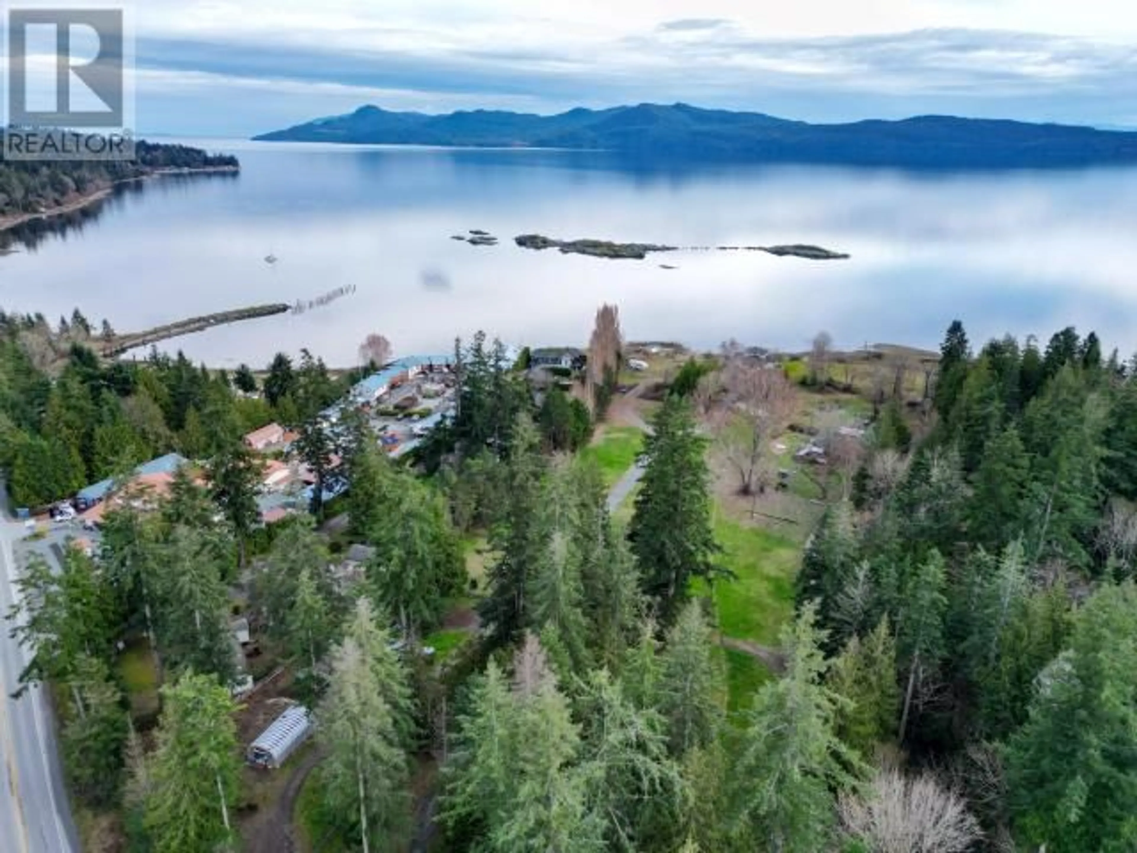 A pic from outside/outdoor area/front of a property/back of a property/a pic from drone, water/lake/river/ocean view for 8035 HIGHWAY 101, Powell River British Columbia V8A0S1