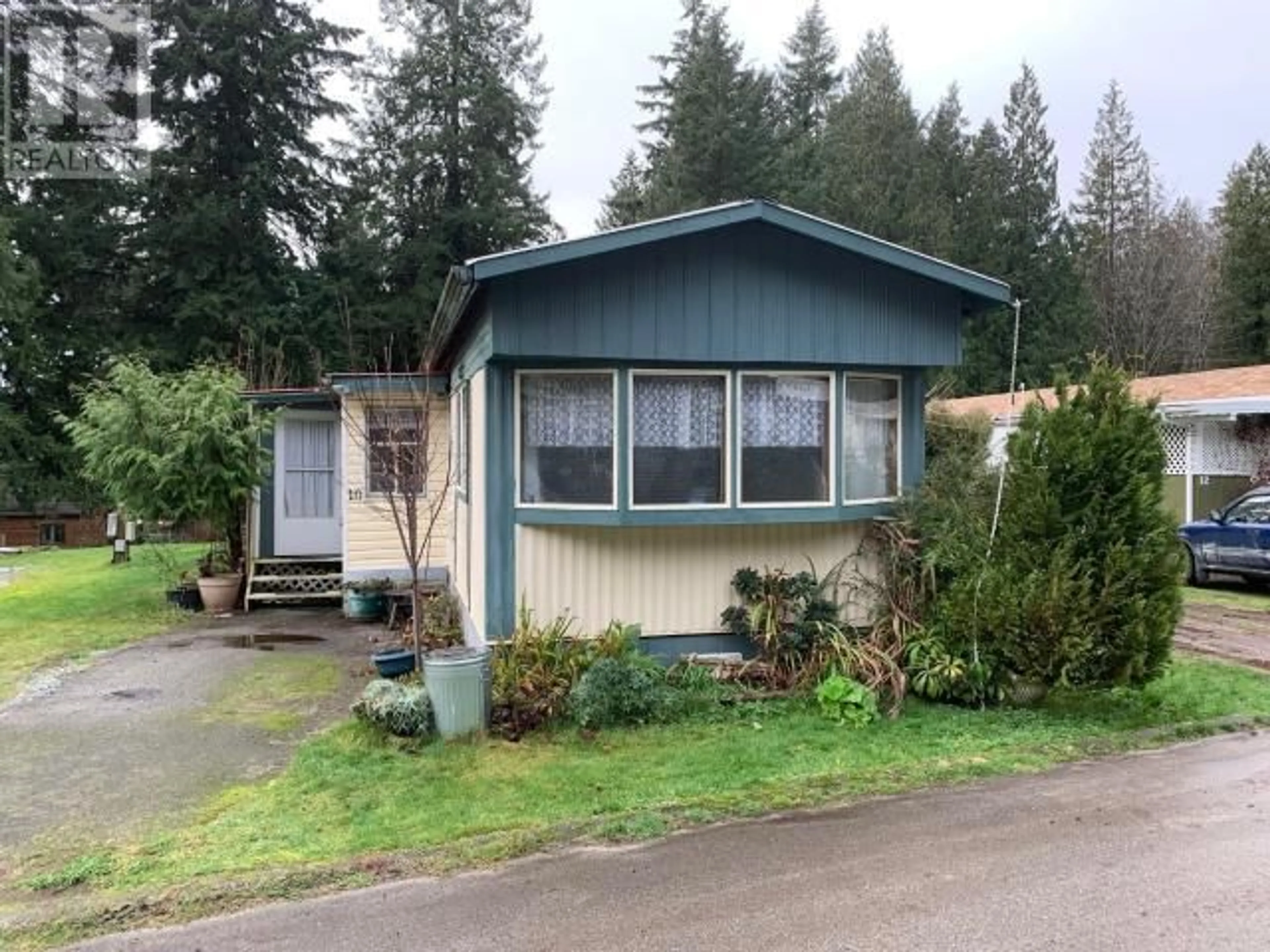 Home with vinyl exterior material, street for 10-8425 HIGHWAY 101, Powell River British Columbia