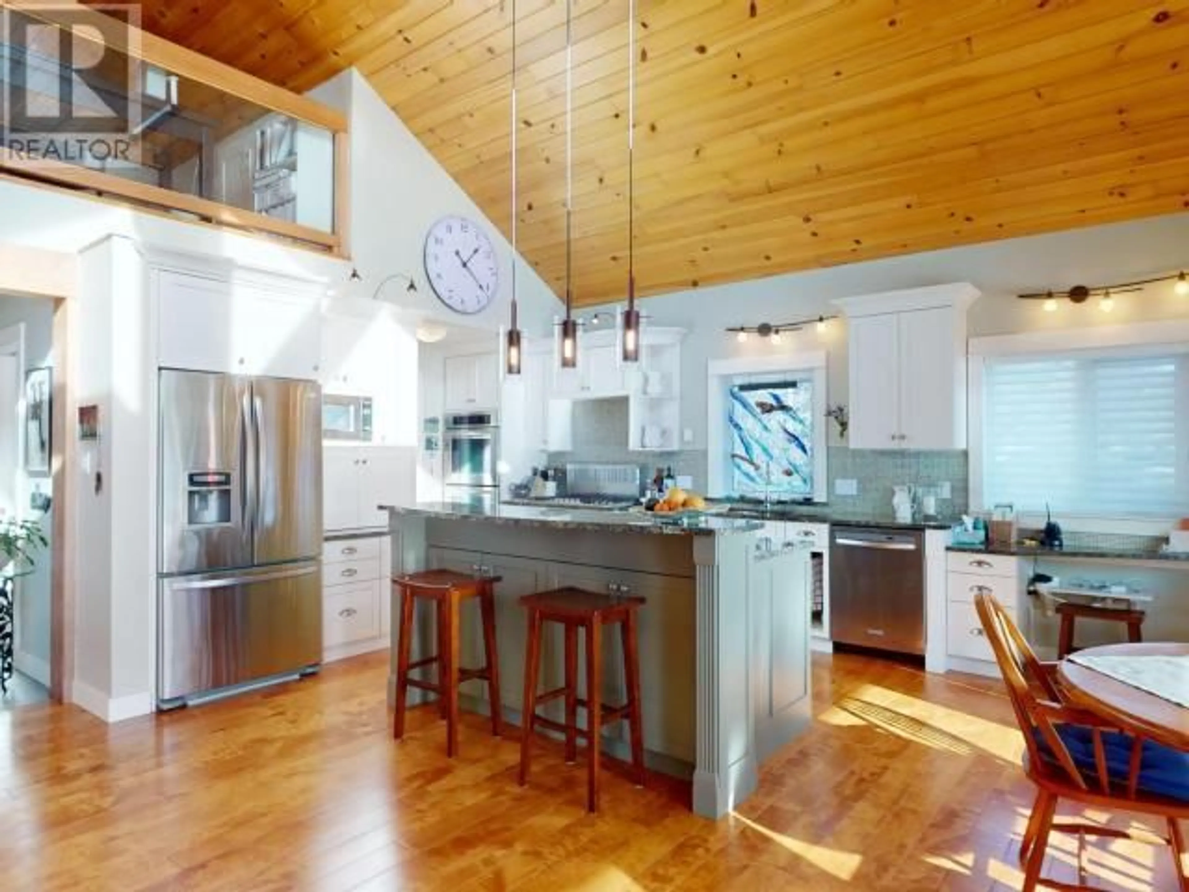 Open concept kitchen, wood/laminate floor for 4810 SANDERSON ROAD, Texada Island British Columbia V0N1W0