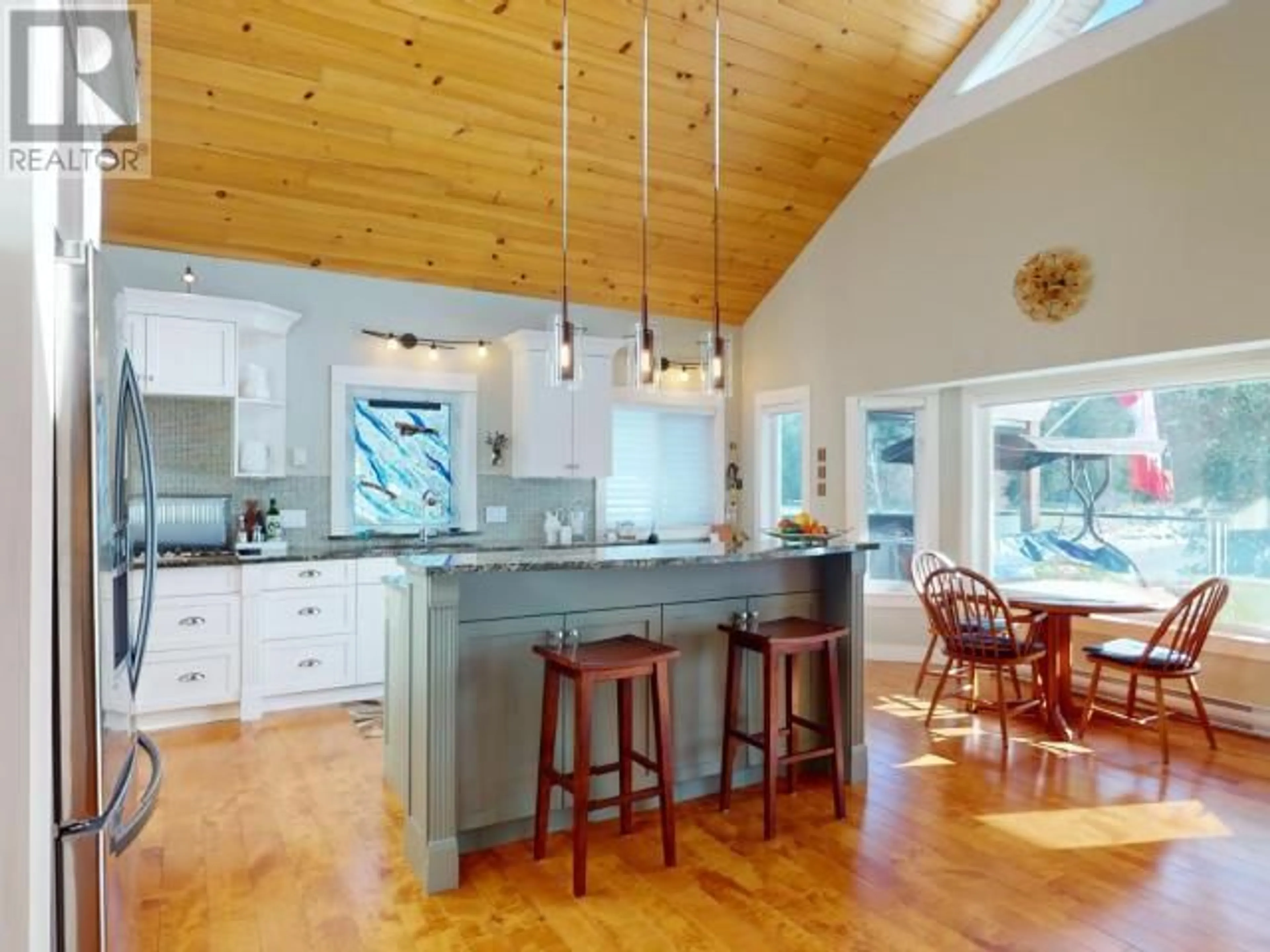 Open concept kitchen, wood/laminate floor for 4810 SANDERSON ROAD, Texada Island British Columbia V0N1W0