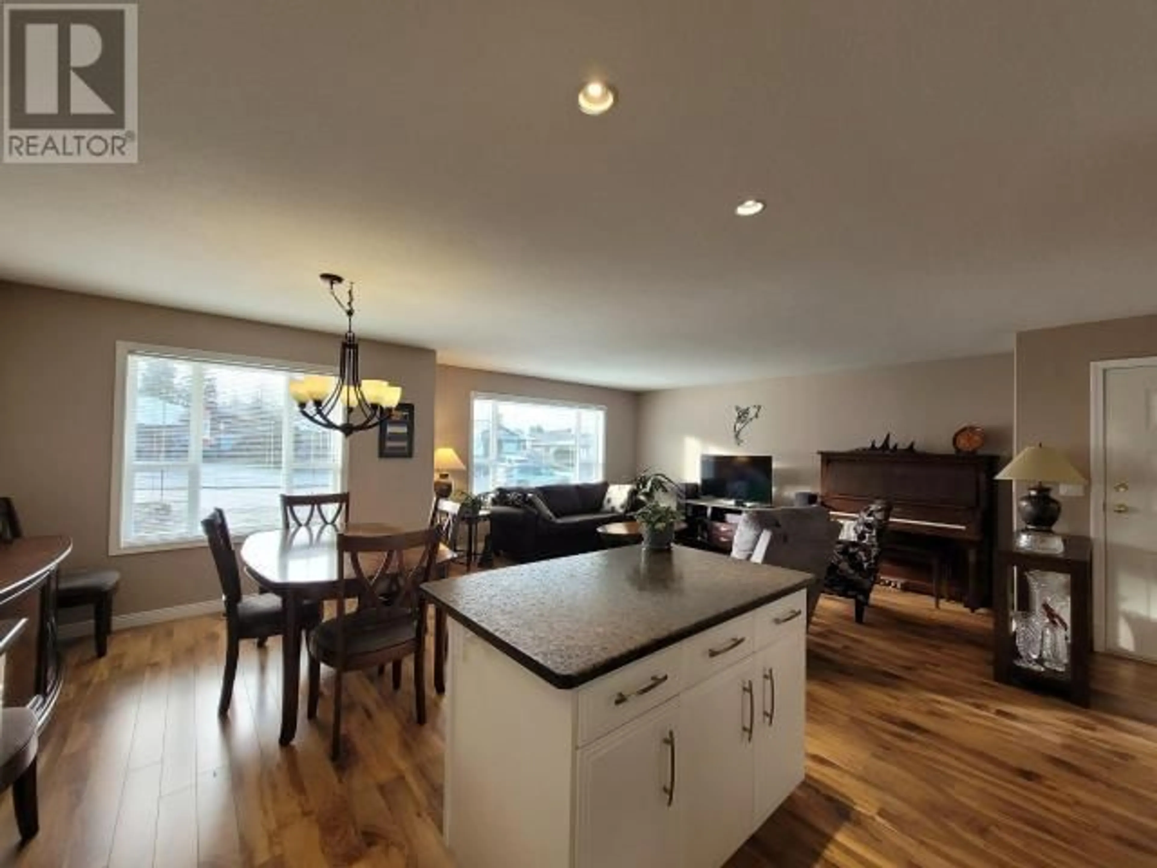 Open concept kitchen, wood/laminate floor for A-7319 GLACIER STREET, Powell River British Columbia V8A5V2