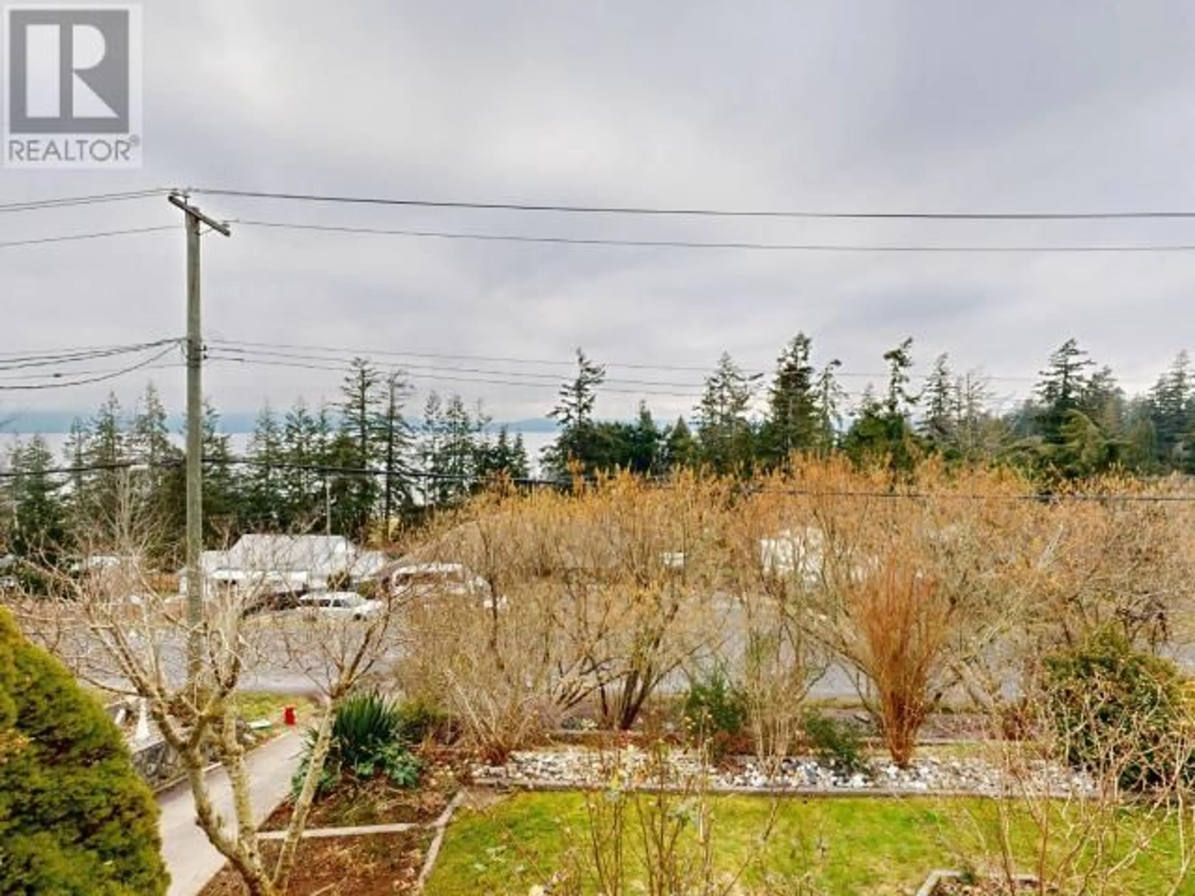 A pic from outside/outdoor area/front of a property/back of a property/a pic from drone, forest/trees view for 8106 CENTENNIAL DRIVE, Powell River British Columbia