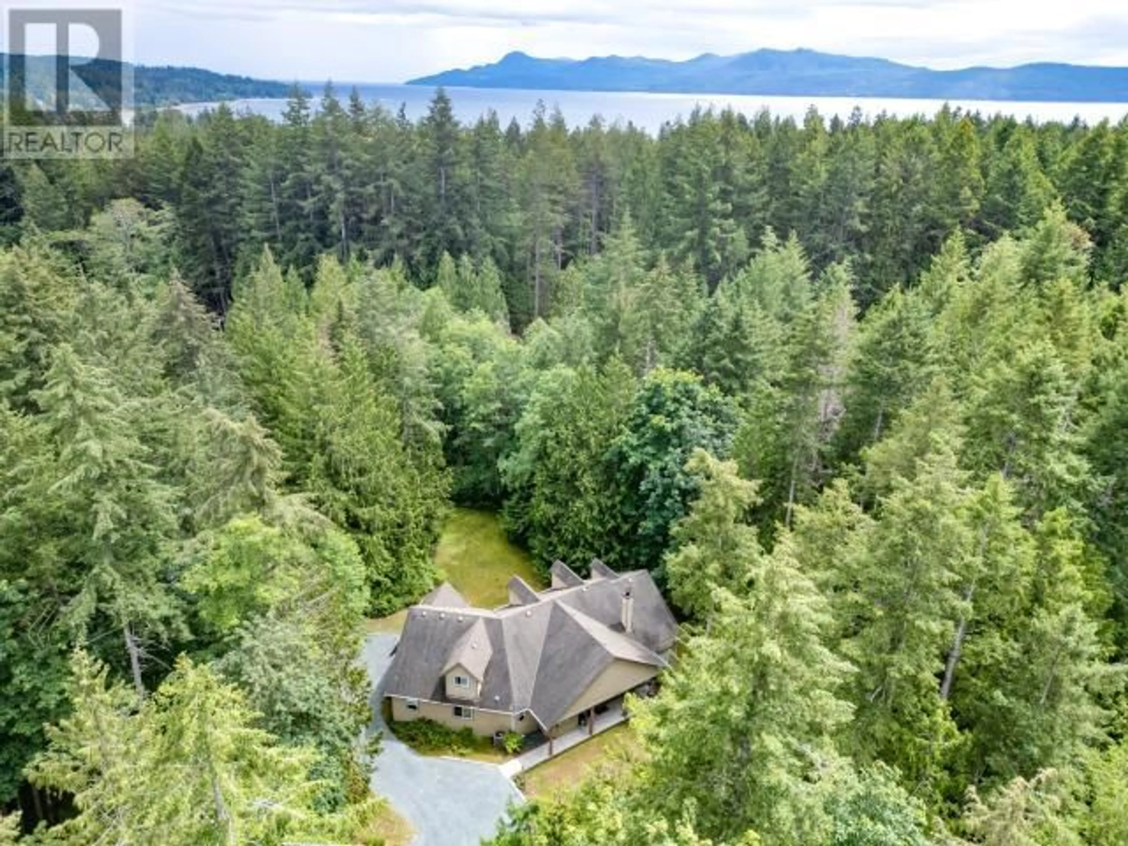 A pic from outside/outdoor area/front of a property/back of a property/a pic from drone, forest/trees view for 3067 SOUTHILL ROAD, Powell River British Columbia V8A0R4