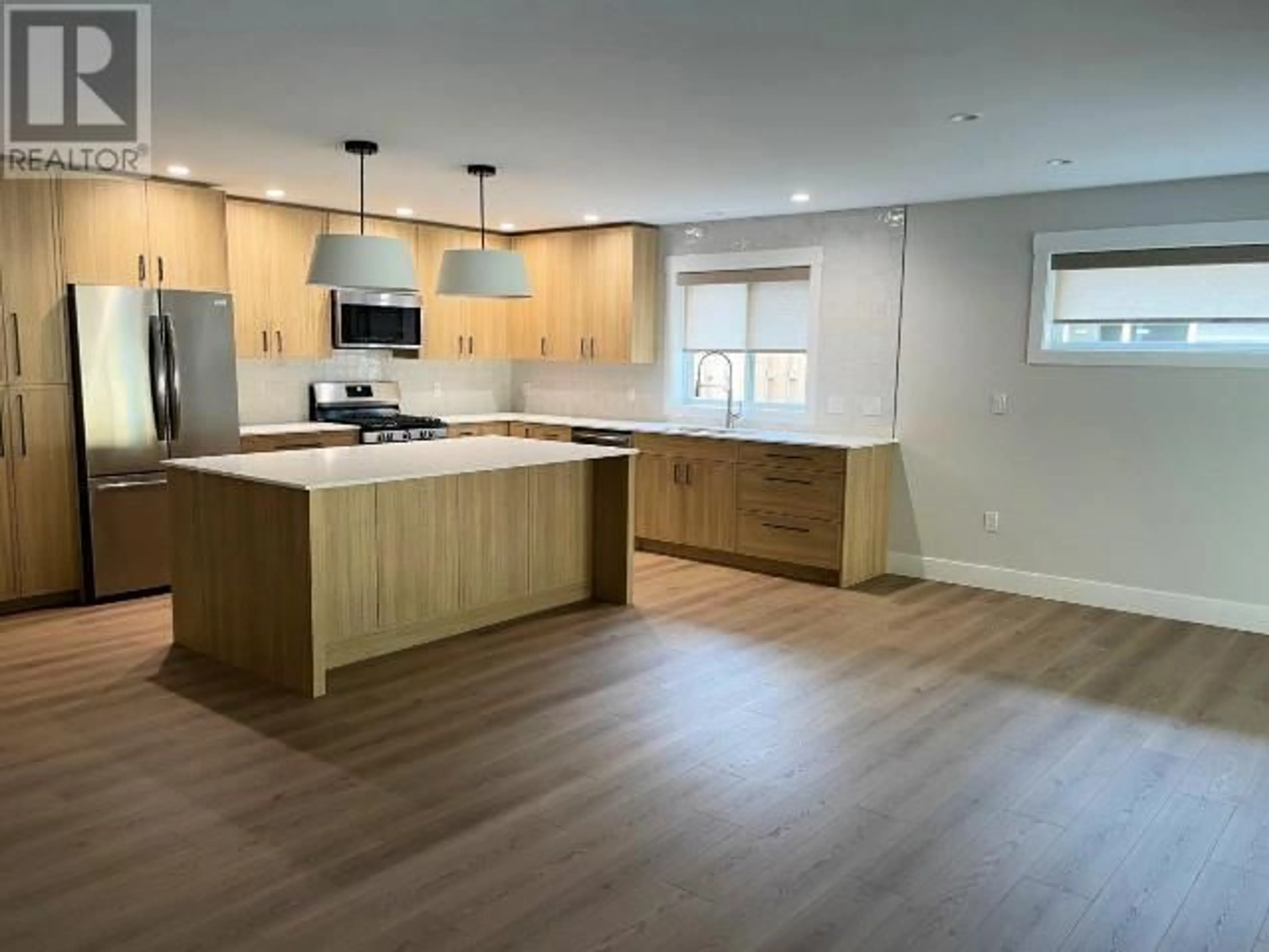 Open concept kitchen, wood/laminate floor for 4100 BEAUSEJOUR AVENUE, Powell River British Columbia