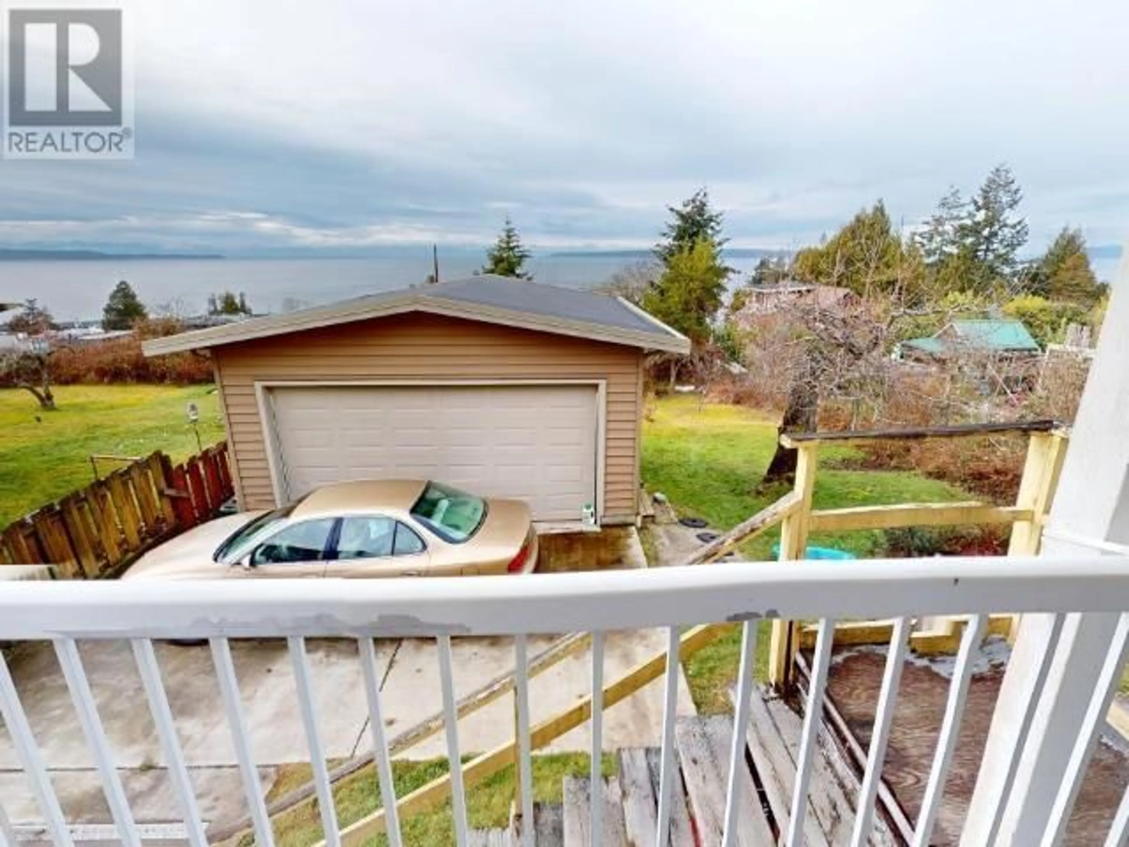 A pic from outside/outdoor area/front of a property/back of a property/a pic from drone, water/lake/river/ocean view for 4579 HARVIE AVE, Powell River British Columbia