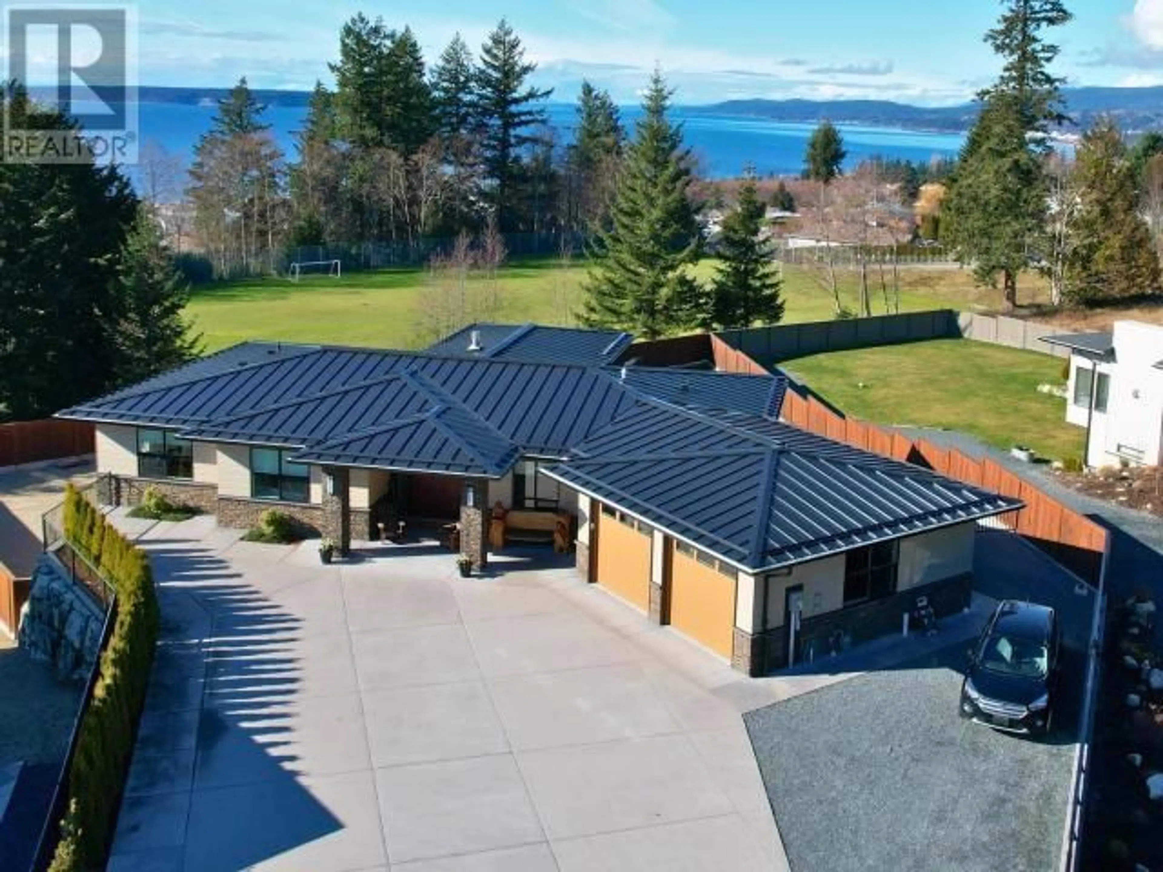 A pic from outside/outdoor area/front of a property/back of a property/a pic from drone, water/lake/river/ocean view for 3949 EAGLE RIDGE PLACE, Powell River British Columbia V8A0A7