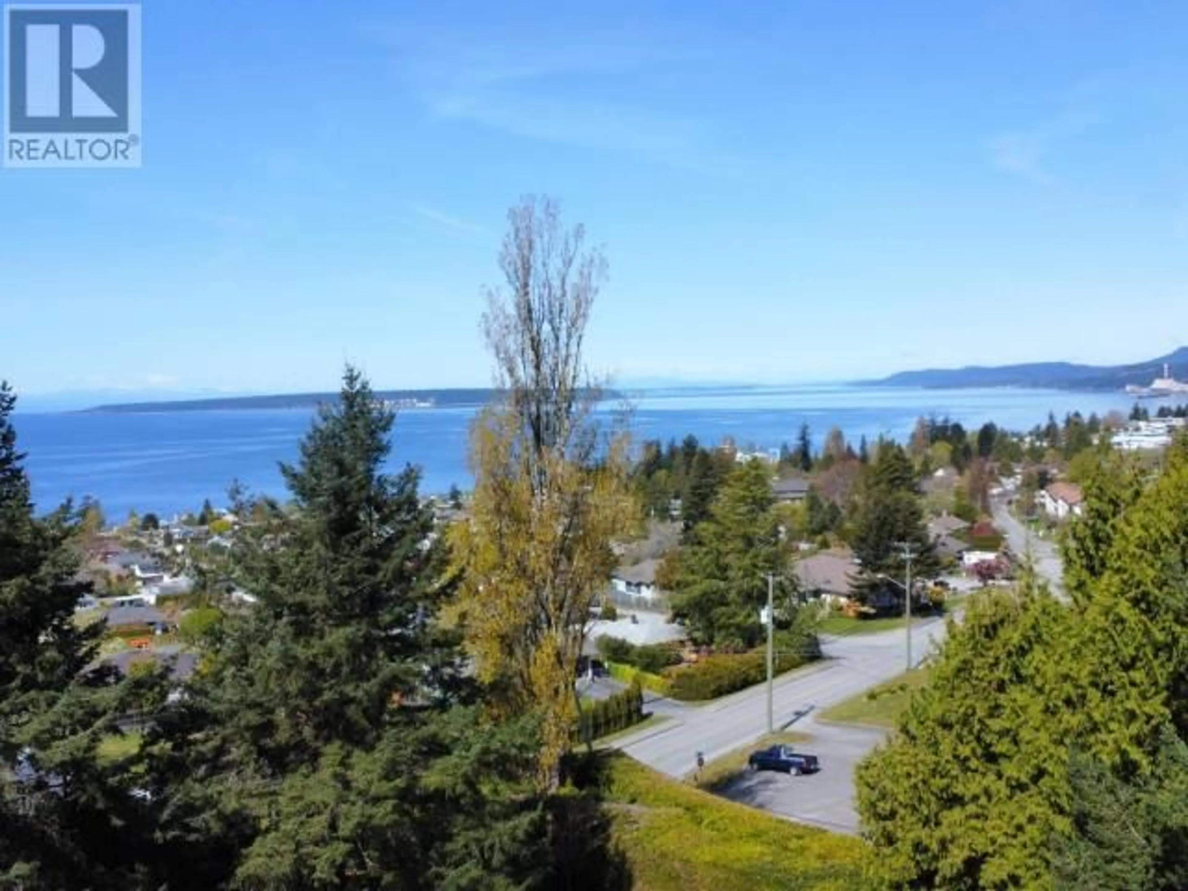 A pic from outside/outdoor area/front of a property/back of a property/a pic from drone, water/lake/river/ocean view for 7108 KEMANO STREET, Powell River British Columbia V8A1L9