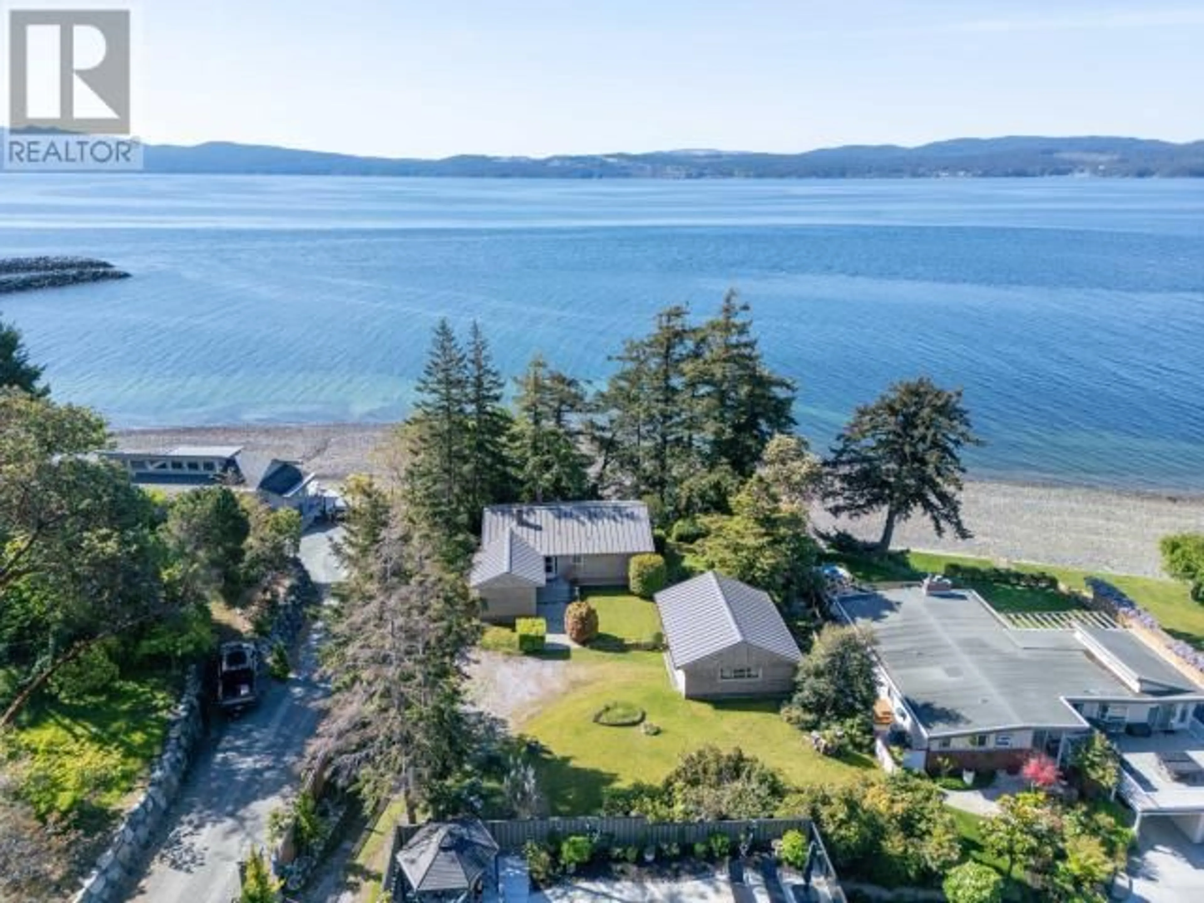 A pic from outside/outdoor area/front of a property/back of a property/a pic from drone, water/lake/river/ocean view for 6956 VICTORIA STREET, Powell River British Columbia V8A1C8