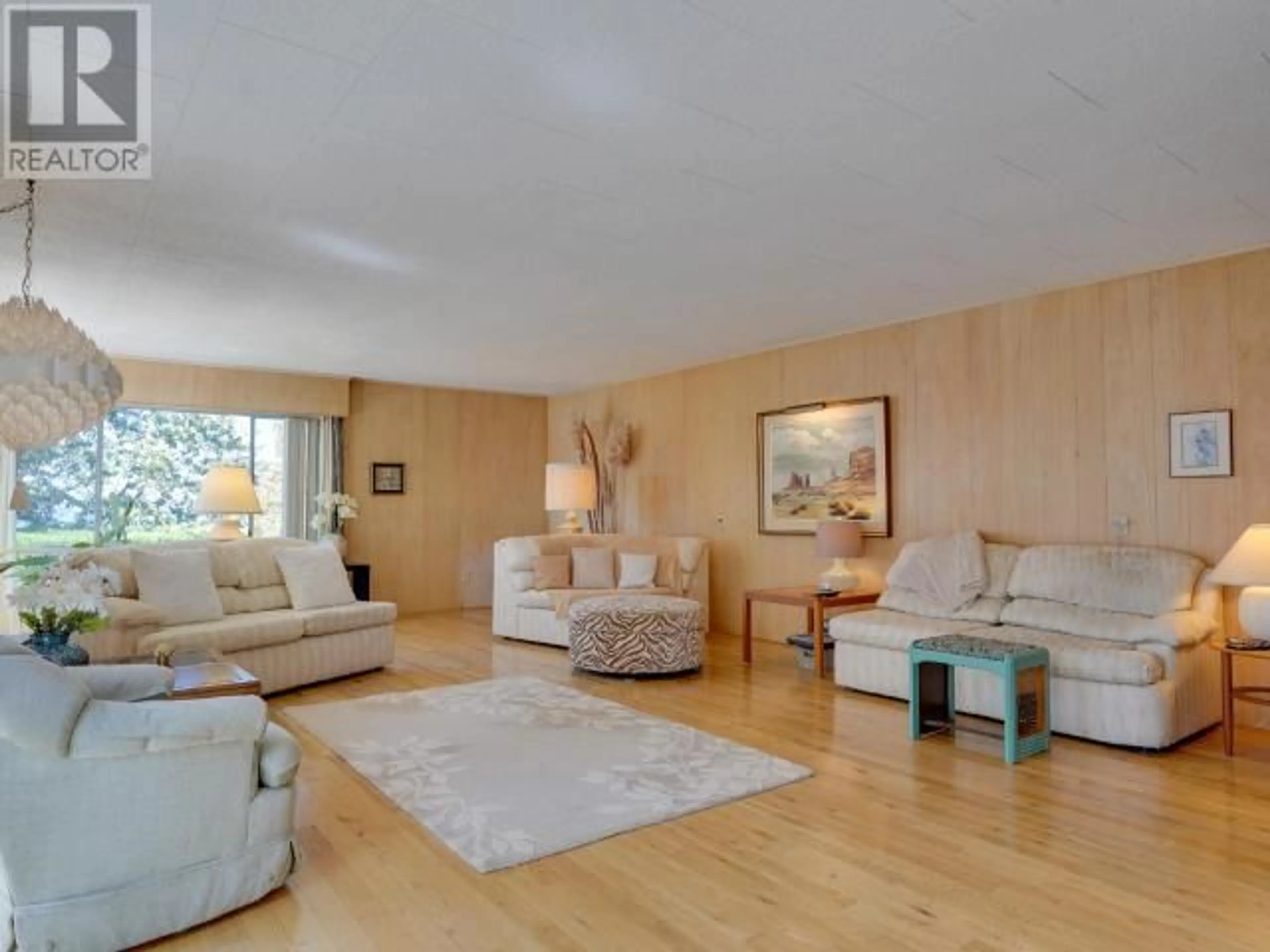 Living room with furniture, wood/laminate floor for 6956 VICTORIA STREET, Powell River British Columbia V8A1C8