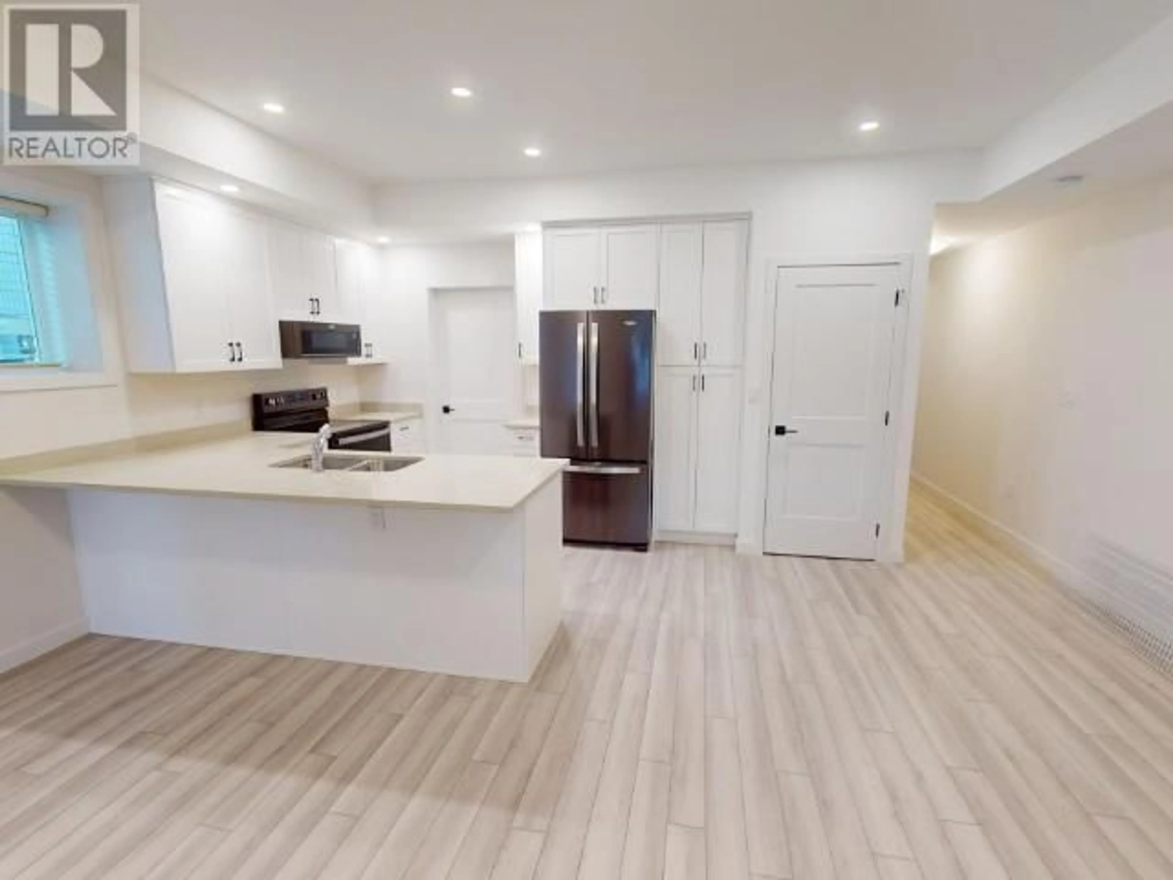 Open concept kitchen, wood/laminate floor for 9 - 6730 CRANBERRY STREET, Powell River British Columbia V8A3Z4