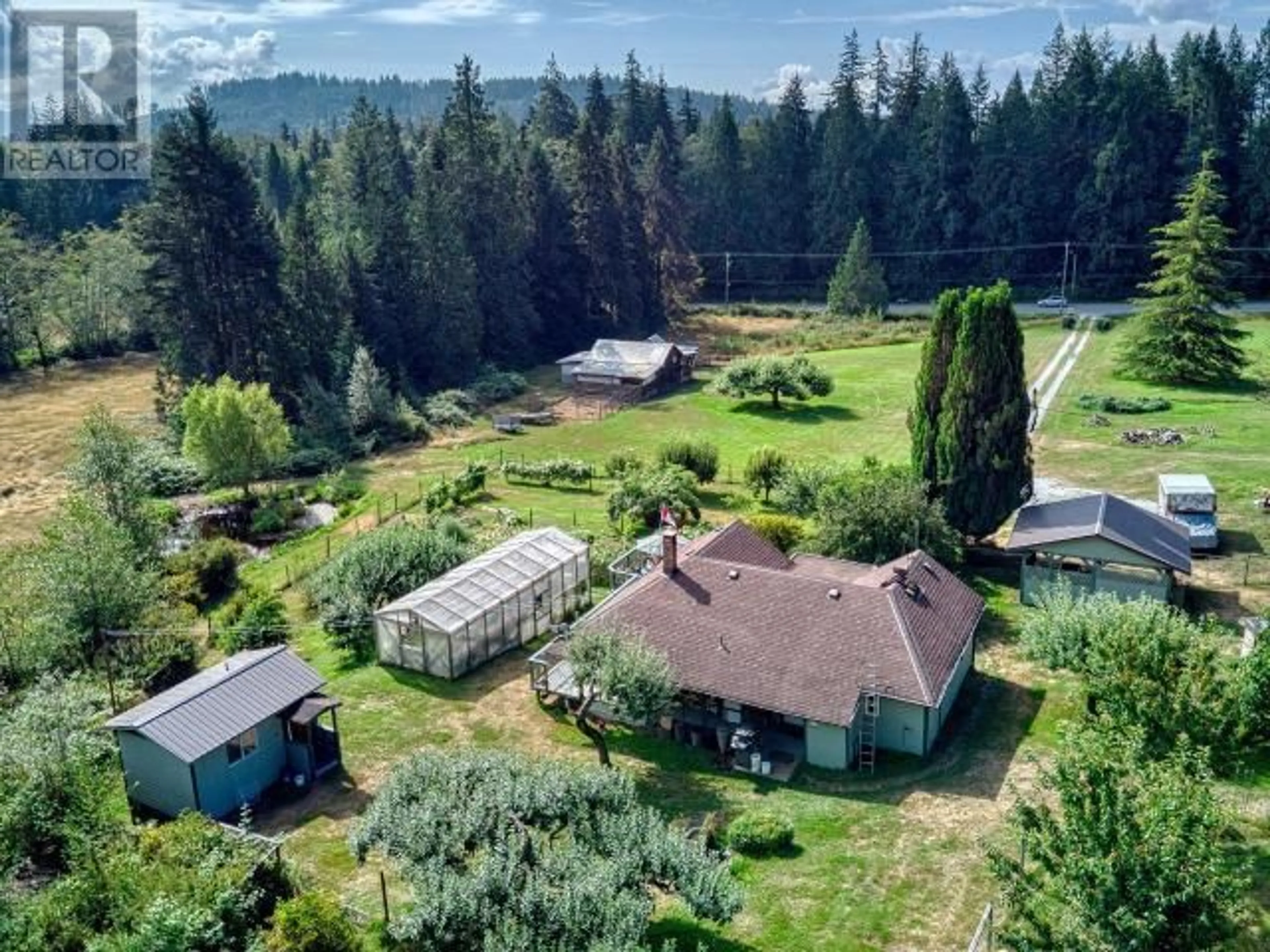 A pic from outside/outdoor area/front of a property/back of a property/a pic from drone, mountain view for 12328 HIGHWAY 101, Powell River British Columbia V8A0M9