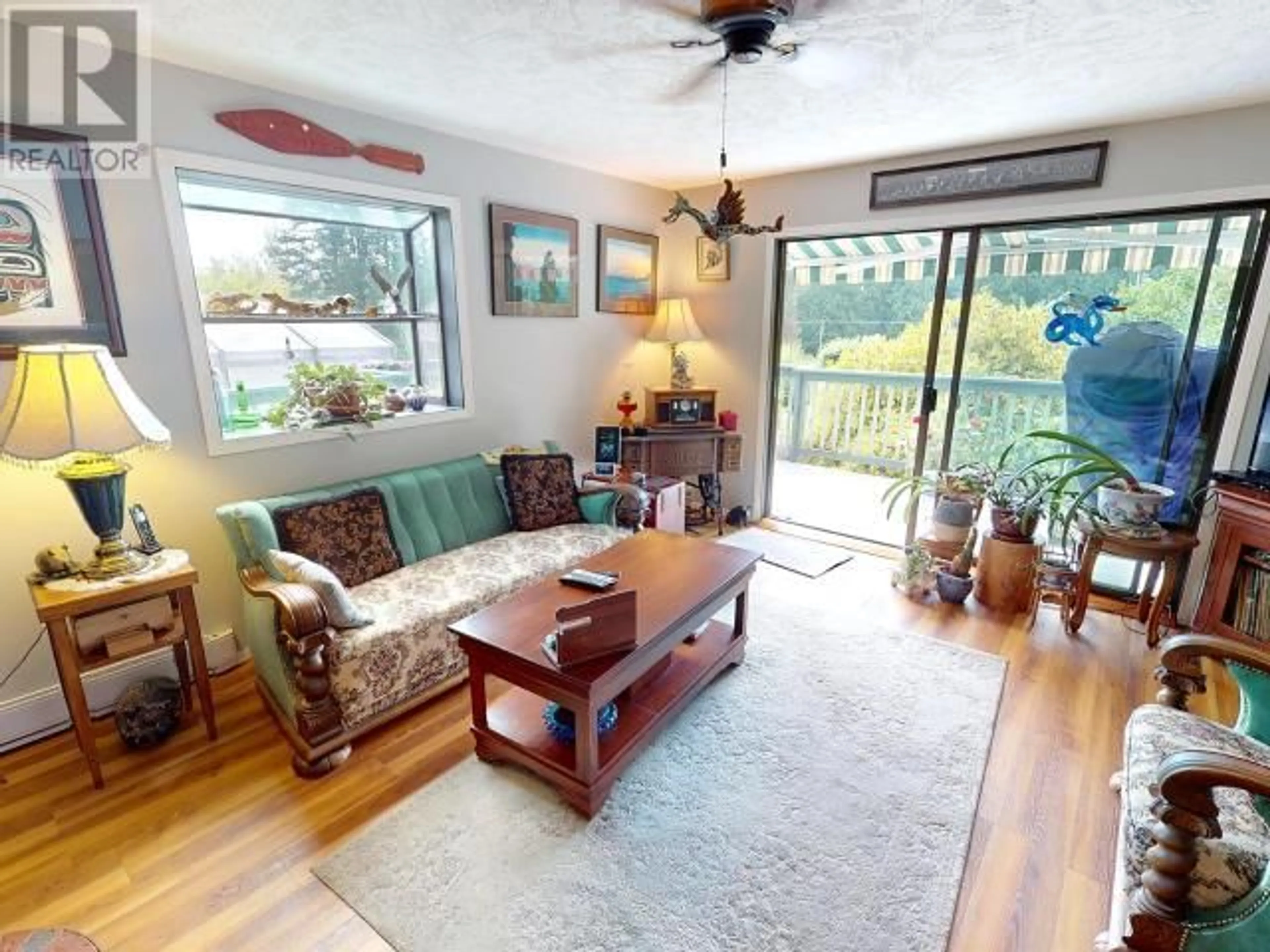Living room with furniture, wood/laminate floor for 12328 HIGHWAY 101, Powell River British Columbia V8A0M9