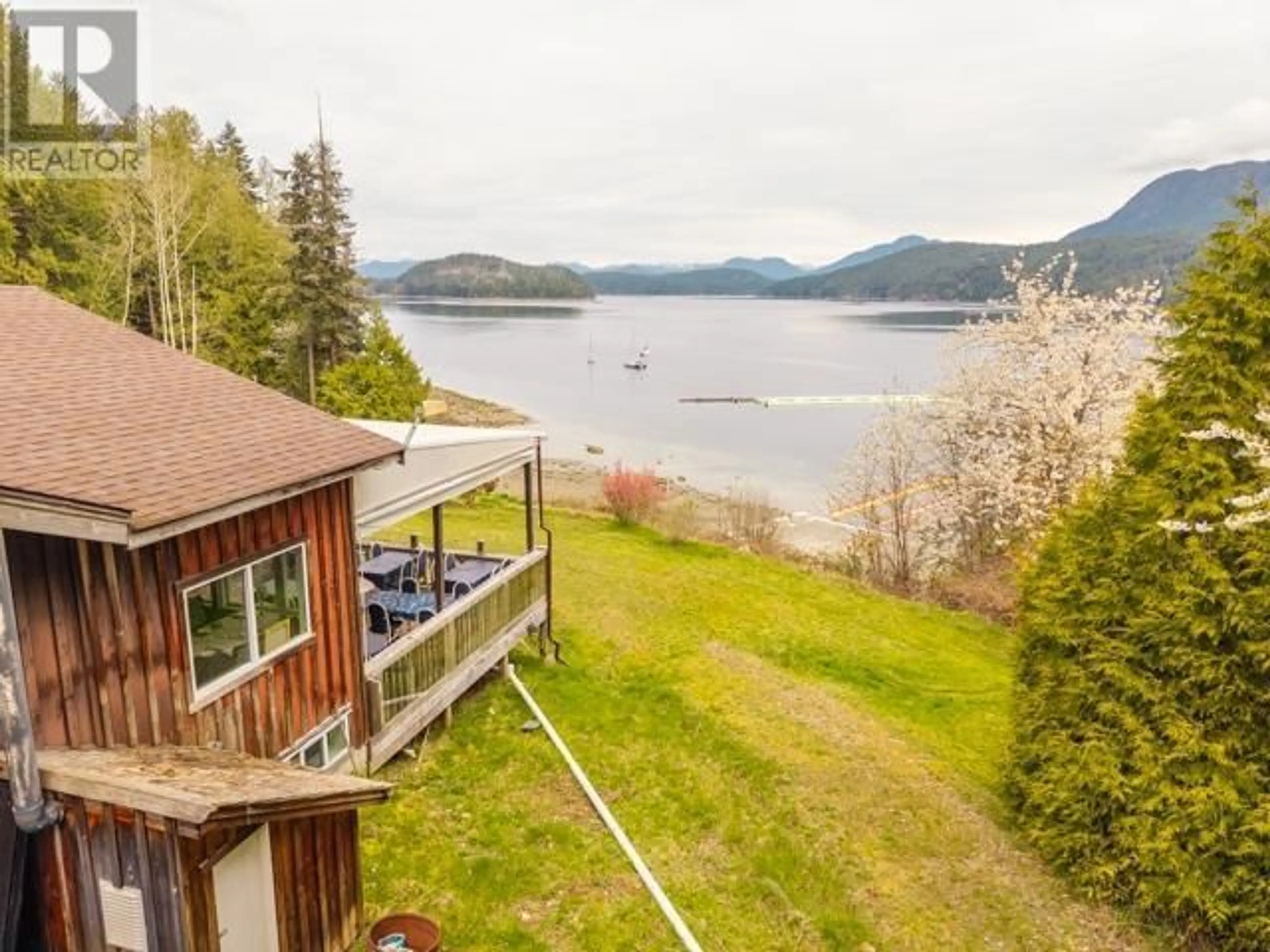 A pic from outside/outdoor area/front of a property/back of a property/a pic from drone, water/lake/river/ocean view for 10052 MALASPINA RD, Powell River British Columbia V8A0G3