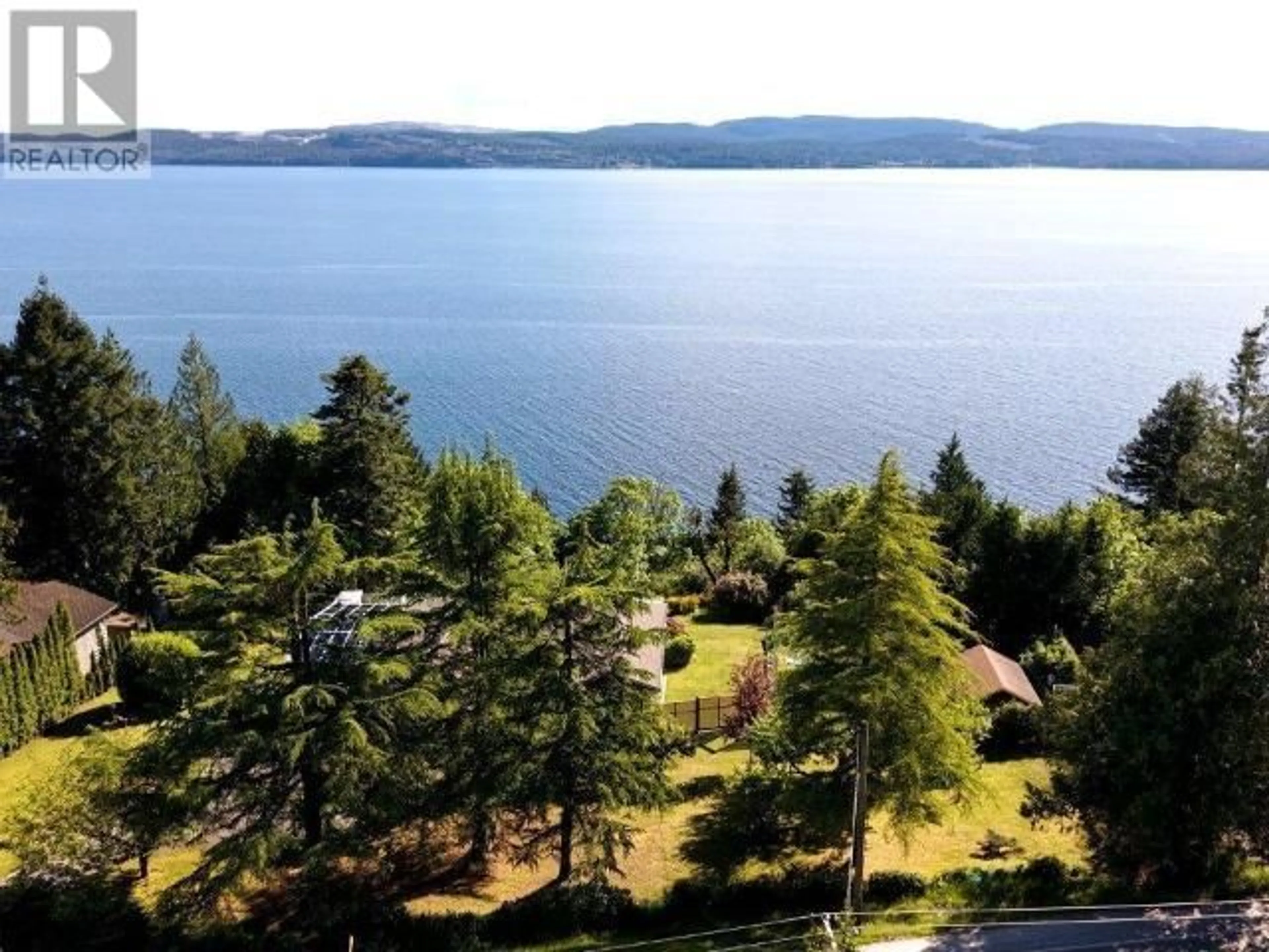 A pic from outside/outdoor area/front of a property/back of a property/a pic from drone, water/lake/river/ocean view for 7457 HIGHWAY 101, Powell River British Columbia