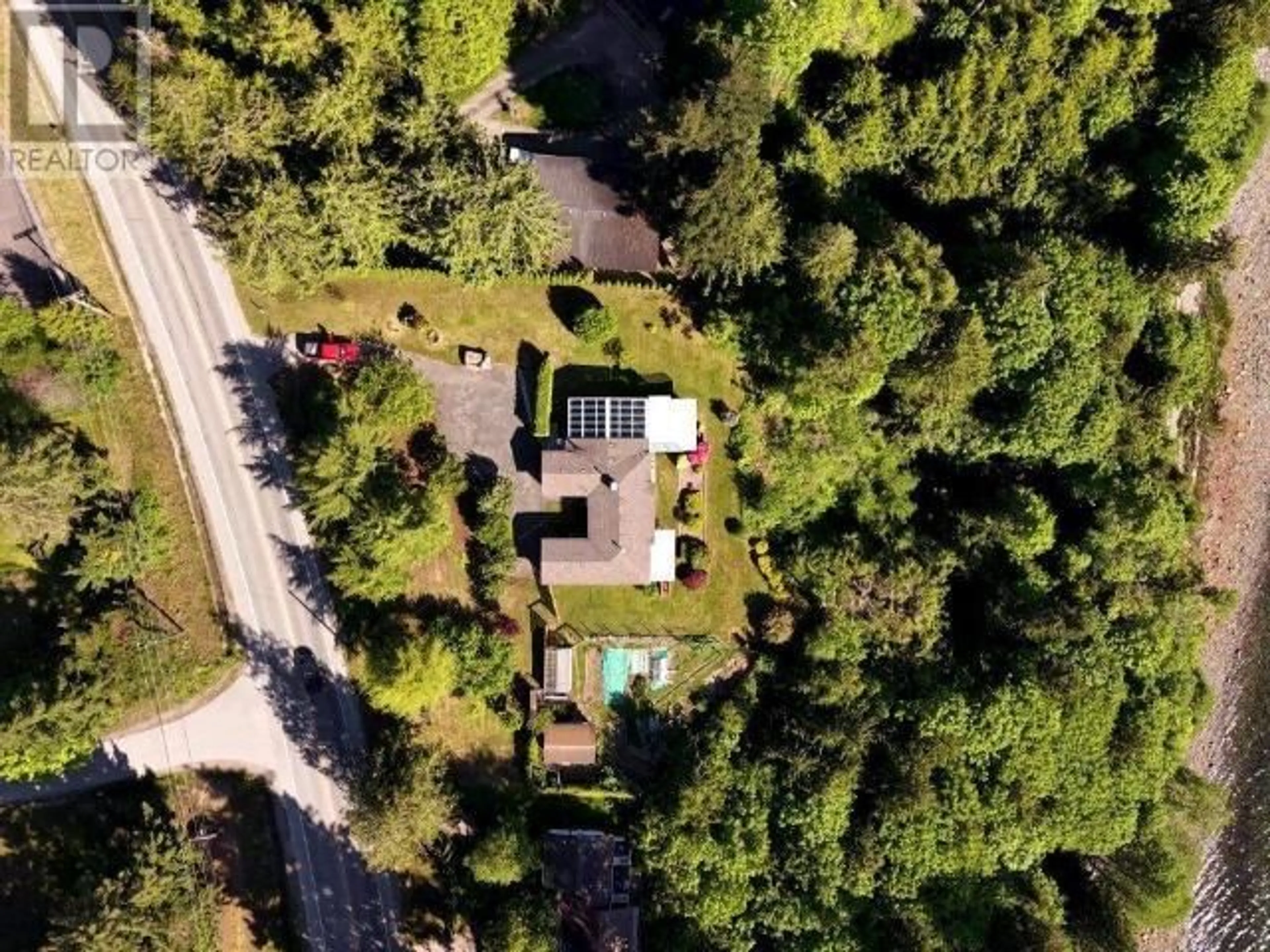 A pic from outside/outdoor area/front of a property/back of a property/a pic from drone, forest/trees view for 7457 HIGHWAY 101, Powell River British Columbia