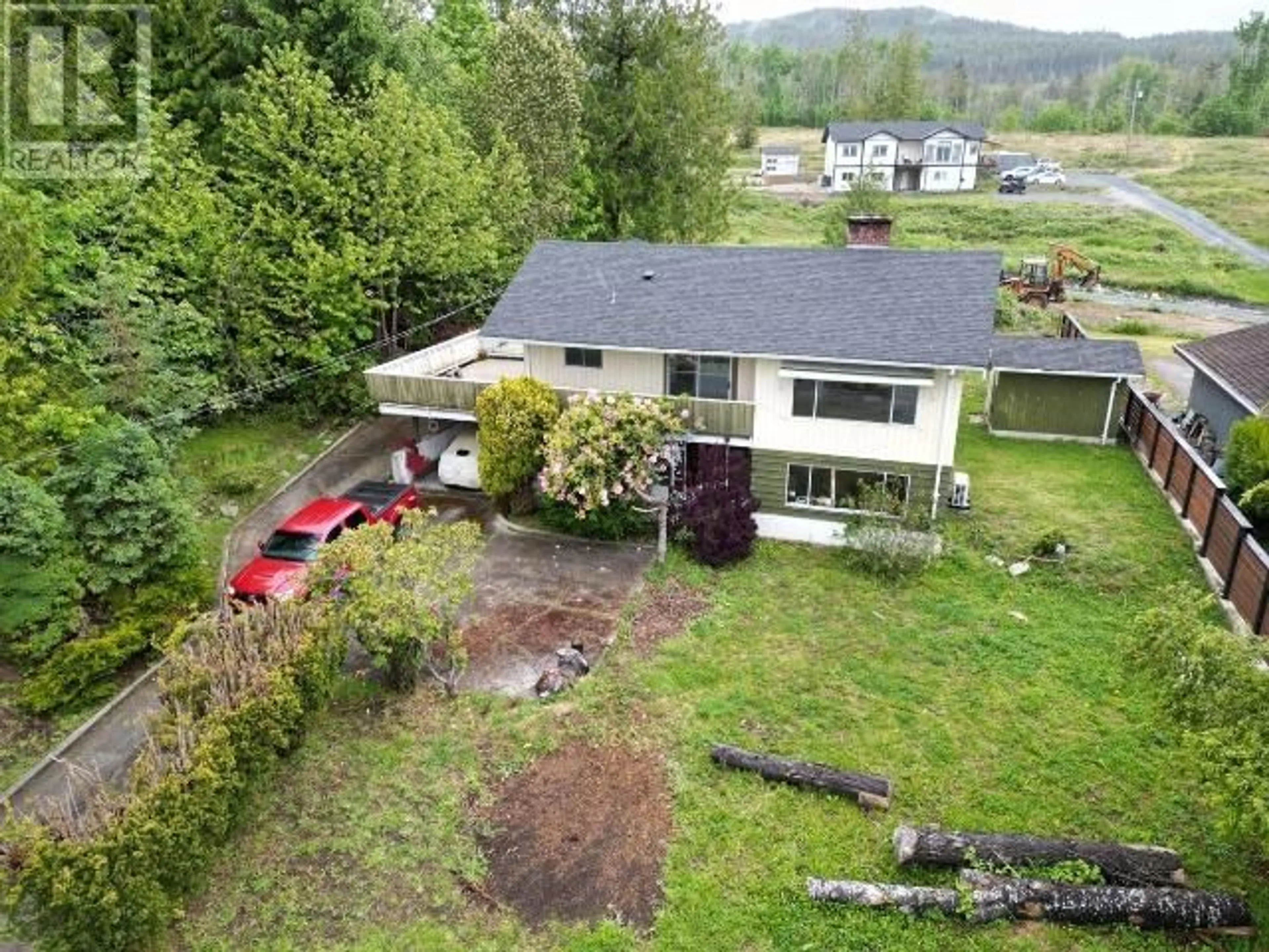 A pic from outside/outdoor area/front of a property/back of a property/a pic from drone, mountain view for 8140 CENTENNIAL DRIVE, Powell River British Columbia