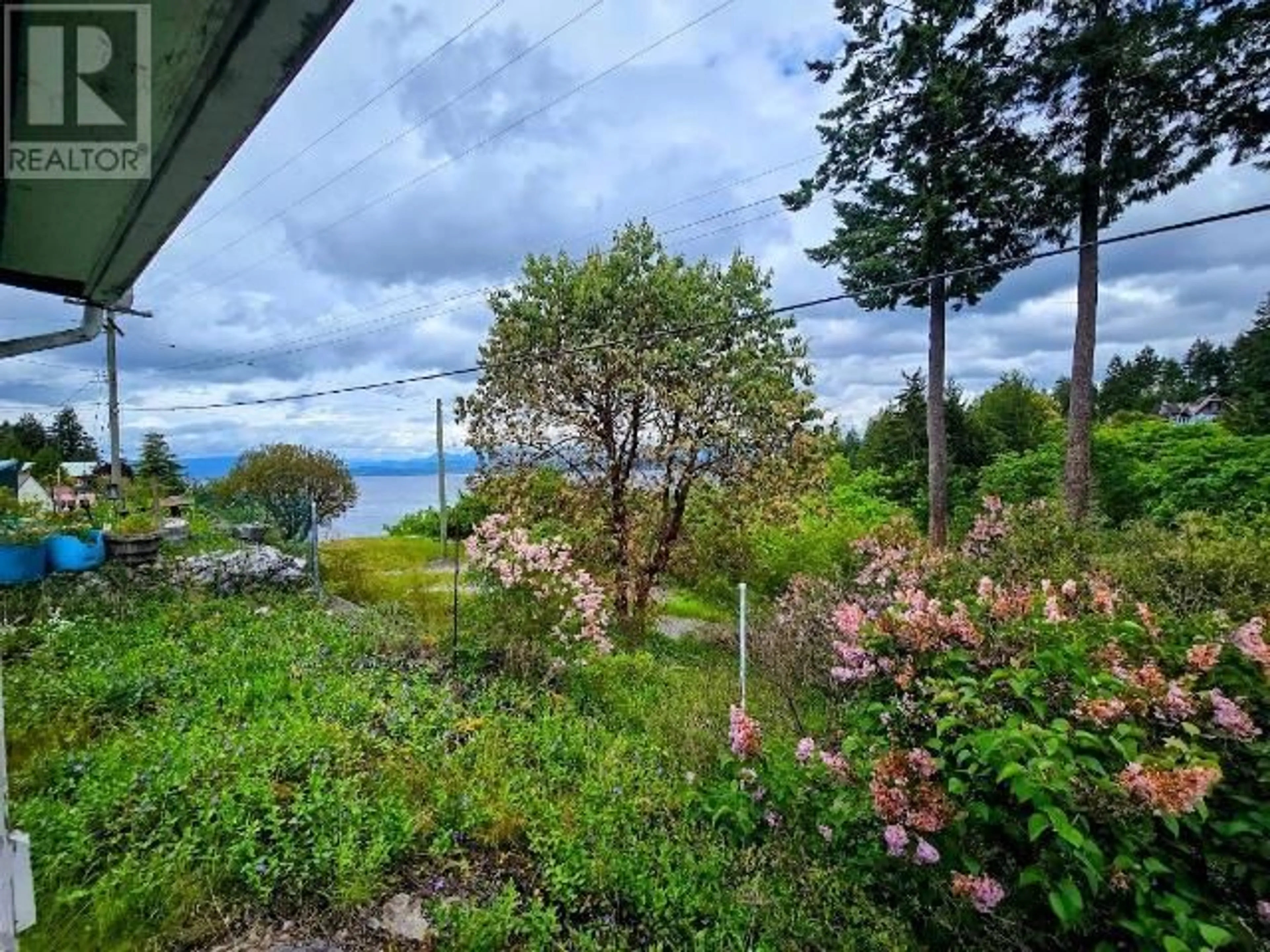 A pic from outside/outdoor area/front of a property/back of a property/a pic from drone, water/lake/river/ocean view for 5180 PARA STREET, Texada Island British Columbia