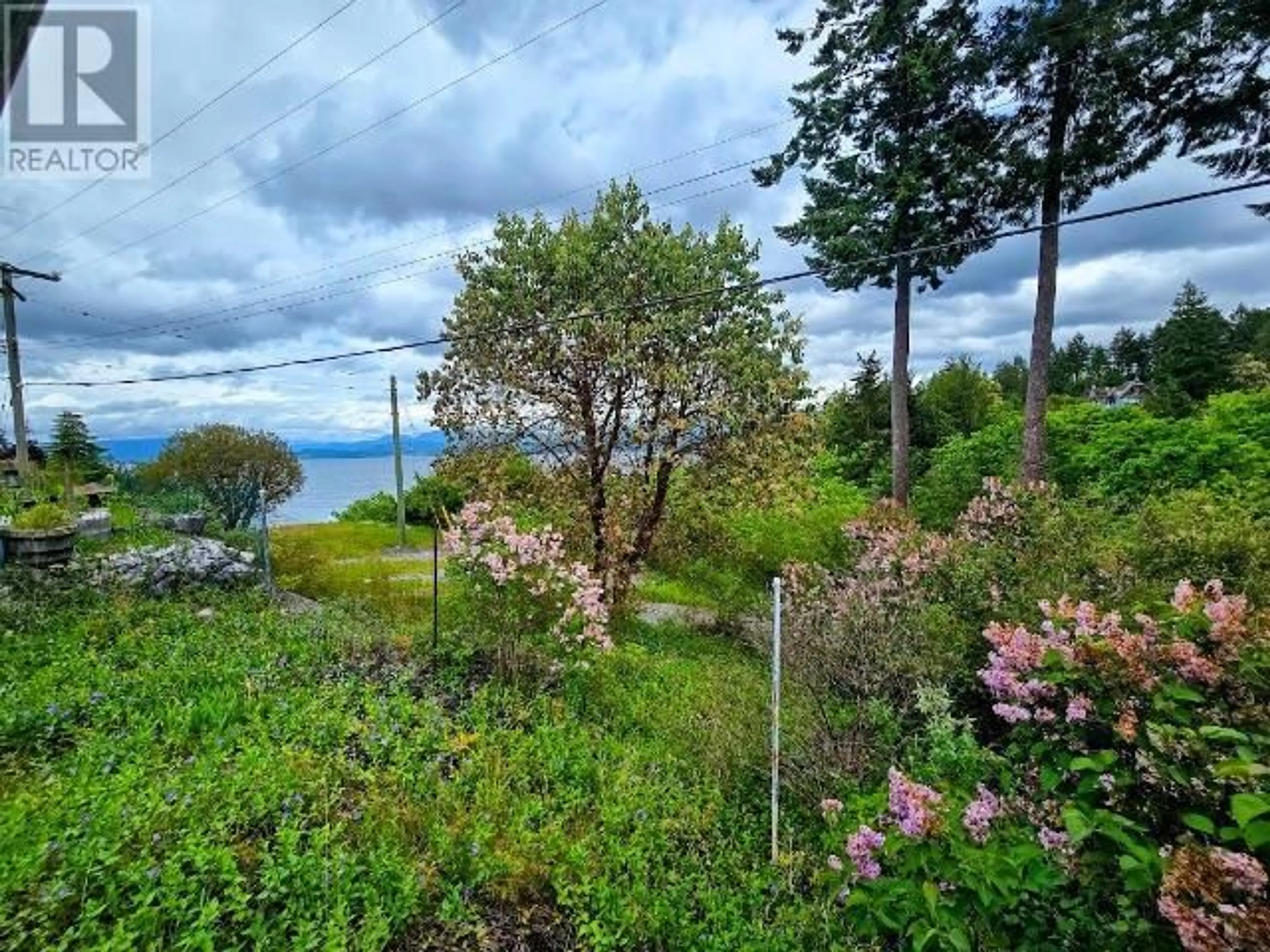 A pic from outside/outdoor area/front of a property/back of a property/a pic from drone, water/lake/river/ocean view for 5180 PARA STREET, Texada Island British Columbia