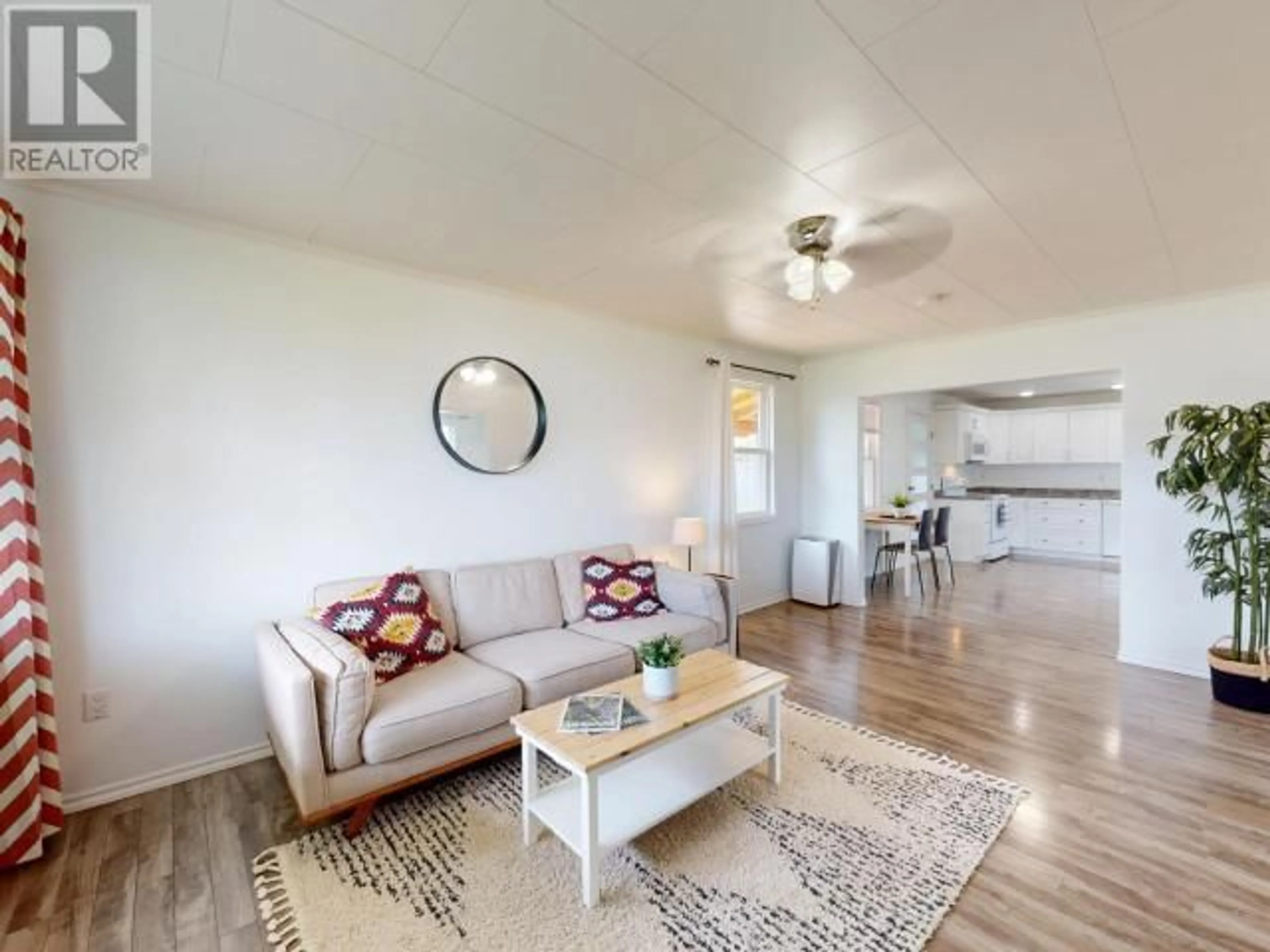 Living room with furniture, wood/laminate floor for 6938 COURTENAY STREET, Powell River British Columbia V8A1X7
