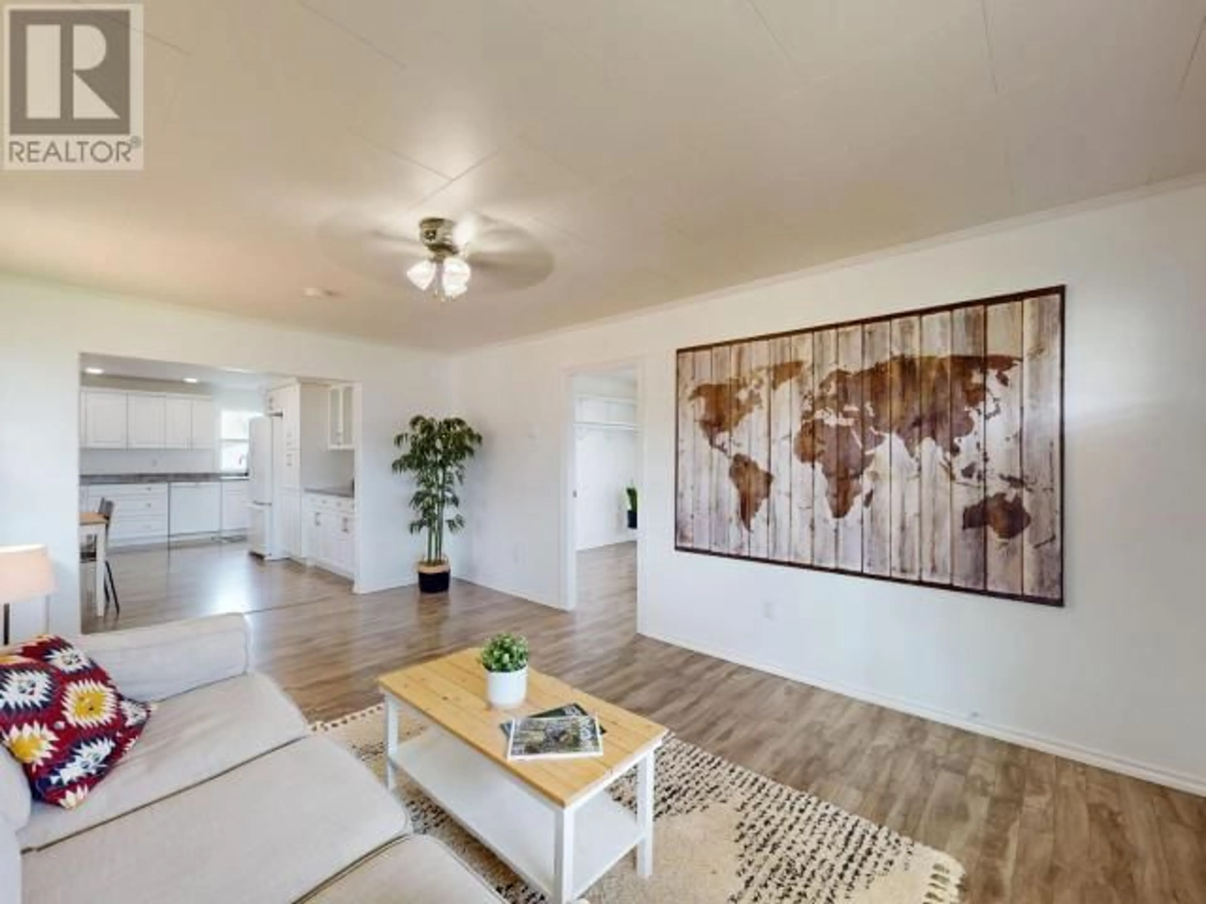 Living room with furniture, wood/laminate floor for 6938 COURTENAY STREET, Powell River British Columbia V8A1X7