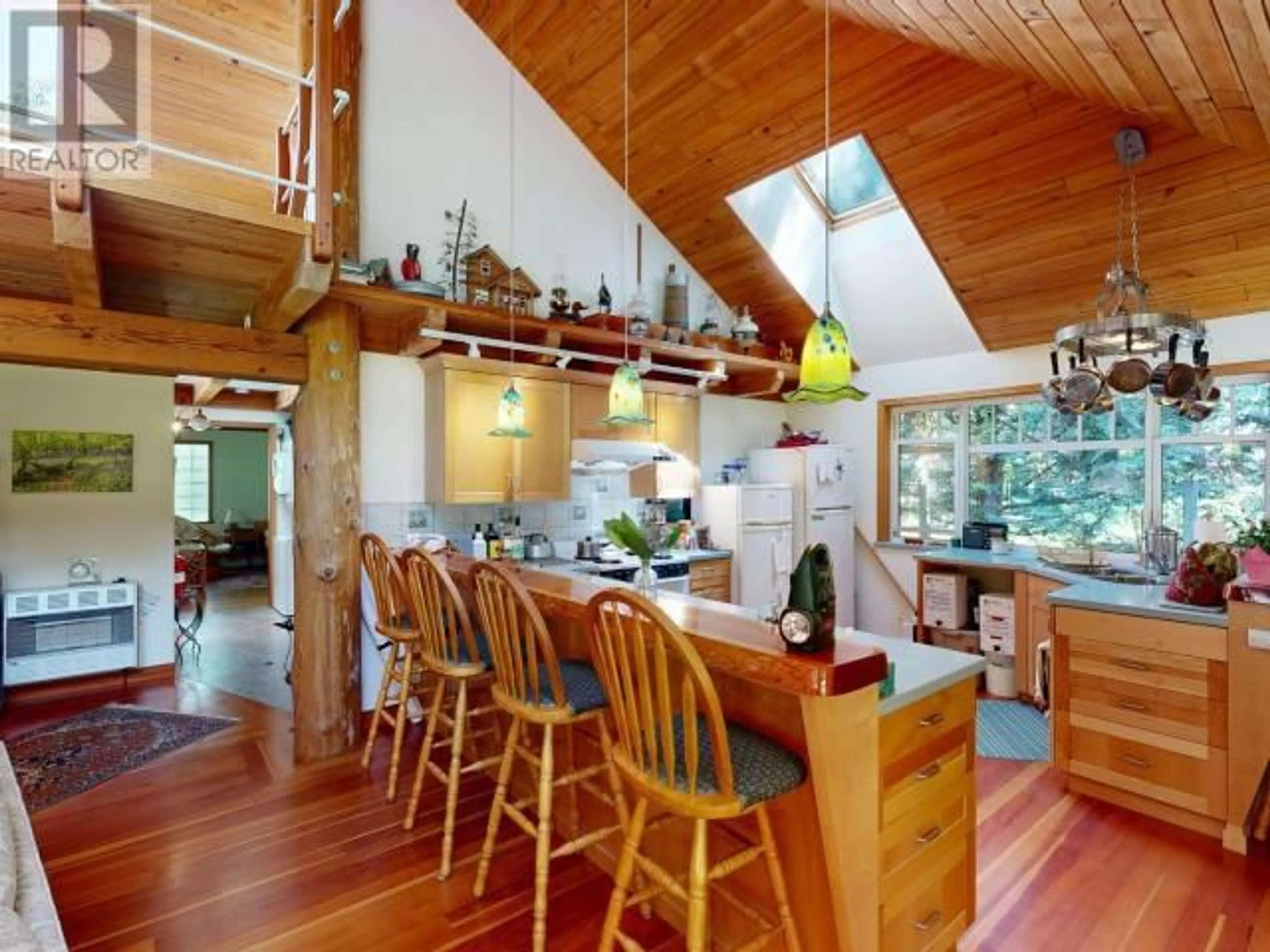 Open concept kitchen, wood/laminate floor for 2777 CEDAR WAY, Savary Island British Columbia V0N2G0