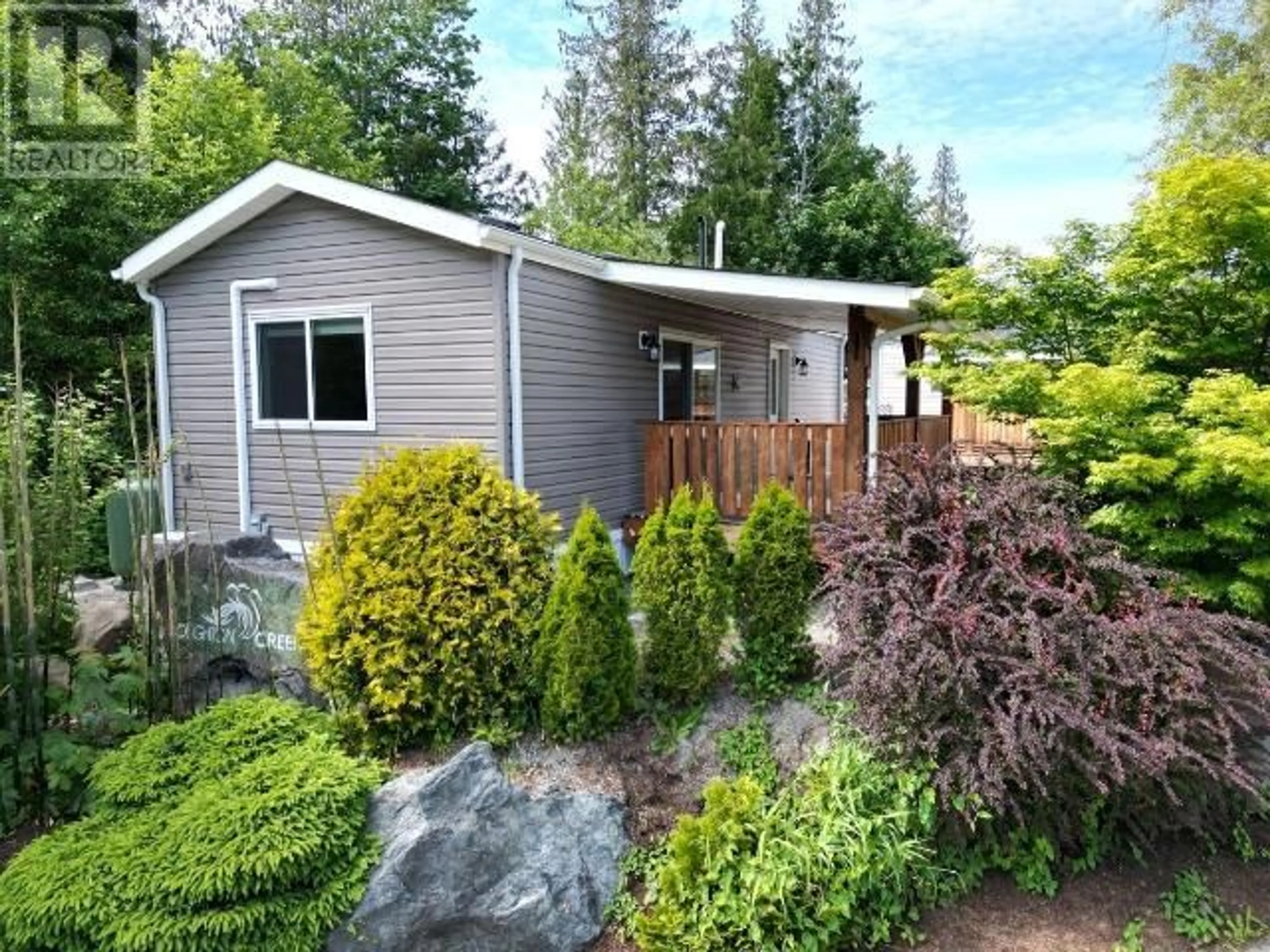 Home with vinyl exterior material, street for 100 SPRINGBROOK ROAD, Powell River British Columbia V8A0S3