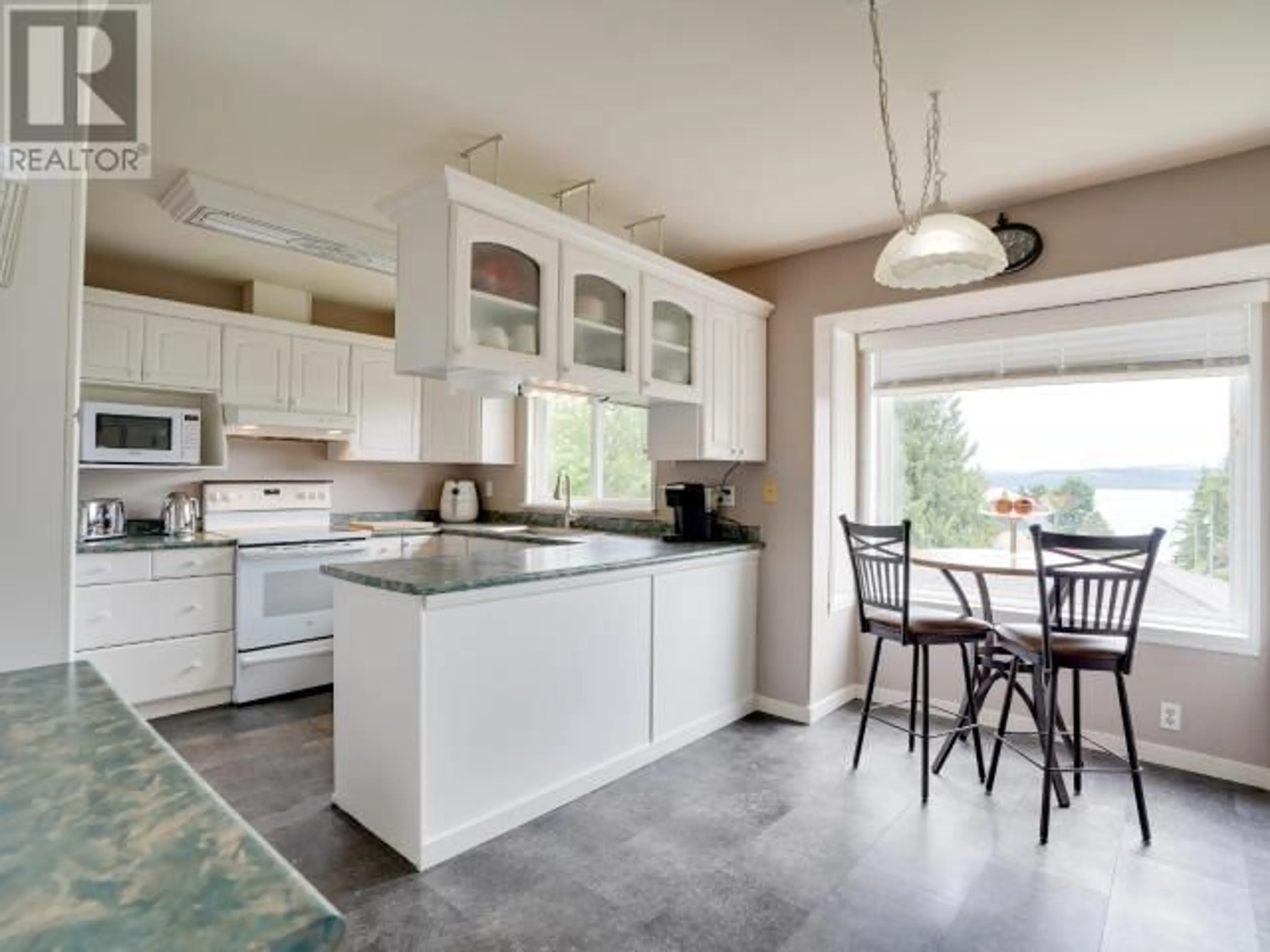 Open concept kitchen, ceramic/tile floor for 7034 THUNDER BAY STREET, Powell River British Columbia V8A1E4