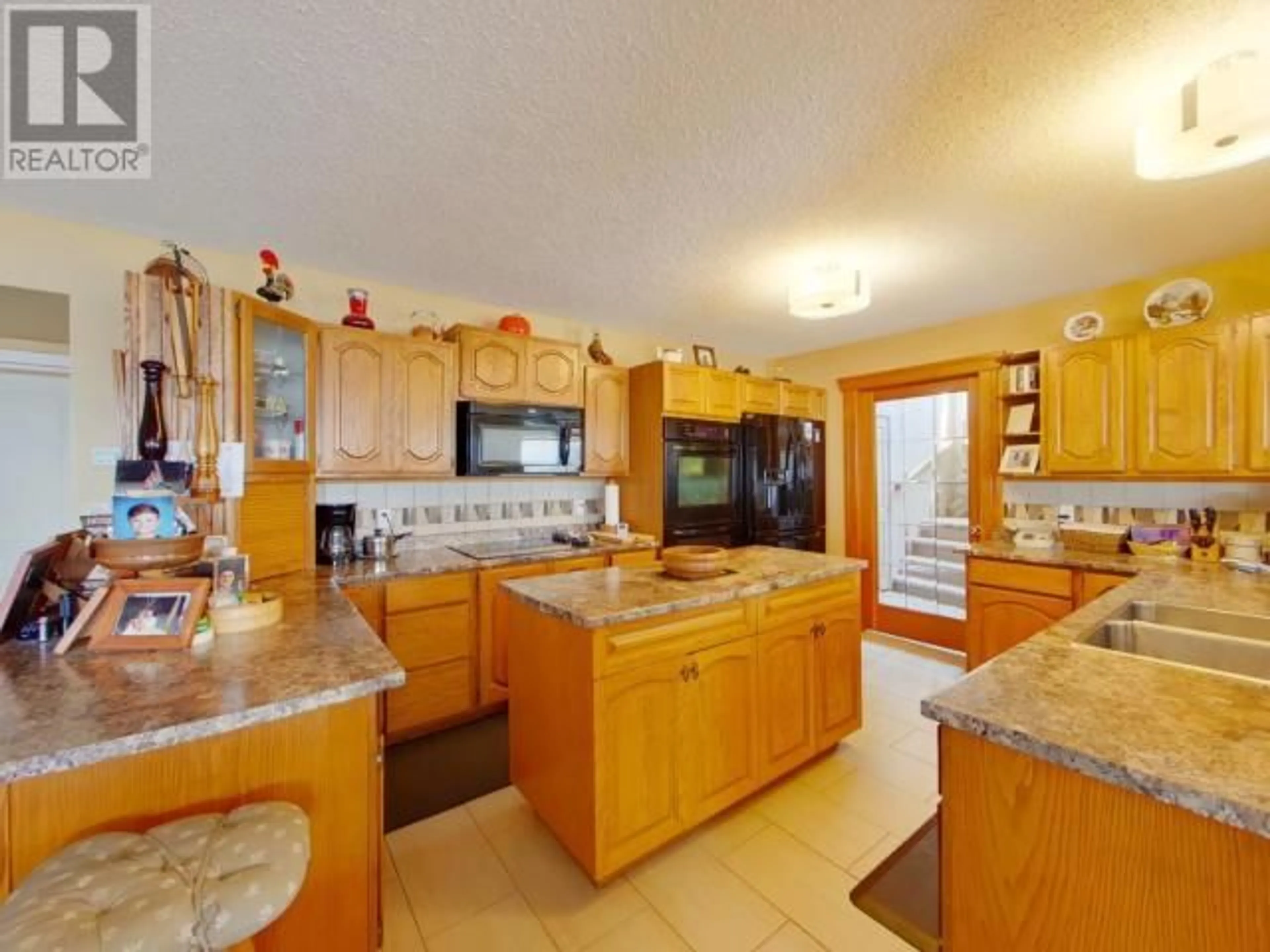Open concept kitchen, ceramic/tile floor for 7397 STURT ROAD, Powell River British Columbia V8A0C8